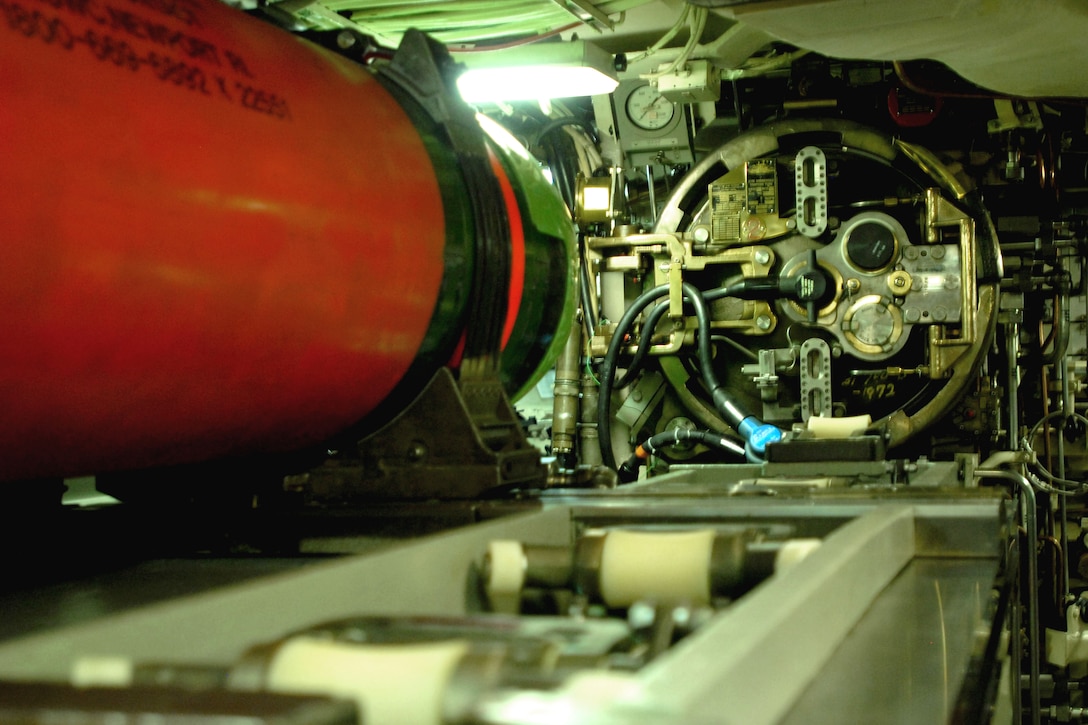 A torpedo release hatch is hydraulically controlled to open for a possible torpedo launch from the USS Rhode Island submarine, Aug. 16, 2010, on patrol in the Atlantic Ocean.