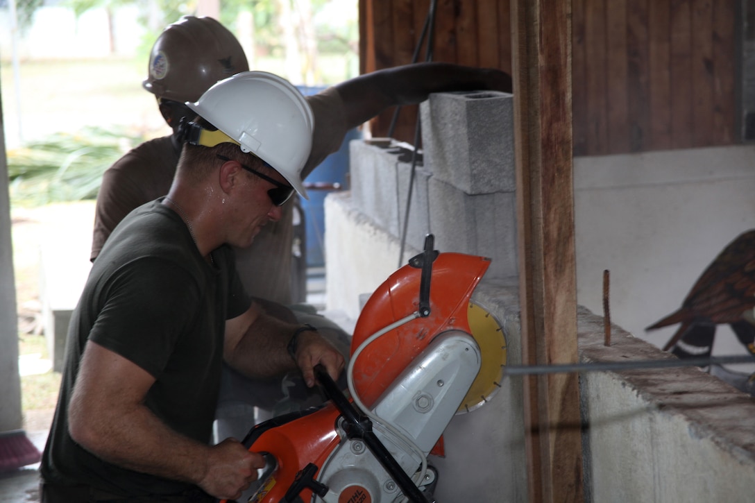 Lance Cpl. Robert T. Simon, native of Harleton, Texas, and basic water support technician with 8th Engineer Support Battalion, Logistics Combat Element of Special-Purpose Marine Air-Ground Task Force Continuing Promise 2010, cuts into a concrete wall where a door will be placed during construction work at an engineer site at the Center of Education and Nutrition in Bribri, Costa Rica, Aug. 24. Marines and Navy Seabees provided construction work at an engineer site to help Costa Ricans during CP10. Marines, sailors and USS Iwo Jima personnel are ported in Limon, Costa Rica, providing medical, dental, veterinary, community relations and engineering services to Costa Ricans as part of the CP10 mission during their deployment to the Caribbean, Central and South America.