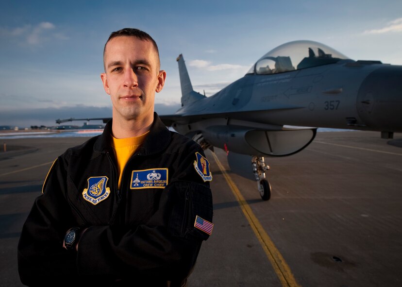 MISAWA AIR BASE, Japan -- Staff Sgt. Daniel Bargielski, Pacific Air Forces Demonstration Team crewchief, stands in front of an F-16 Fighting Falcon in the team's signature black flight suit. Sergeant Bargielski made his final performance with the team at the Chitose Air Festival, Aug. 8. (U.S. Air Force photo/Staff Sgt. Samuel Morse)