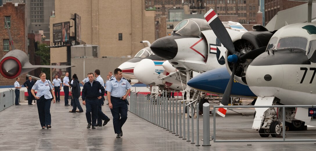 Airmen enjoy the opportunity to roam the decks of the USS Intrepid while visiting New York City during the Air Force Week New York City proclamation ceremony on Aug. 24, 2010. The event at the Intrepid Sea, Air & Space Museum was highlighted by a six-ship flyover by the USAF Thunderbirds. The Honorable Michael Donley, Secretary of the Air Force attended, along with General Raymond Johns, Commander of Air Mobility Command. The Police Commissioner of the City of New York, the Honorable Raymond Kelly, represented NYC. Mr. Greg Kelly of "Good Day New York" was emcee for this event. (U.S. Air Force photo/Lance Cheung)