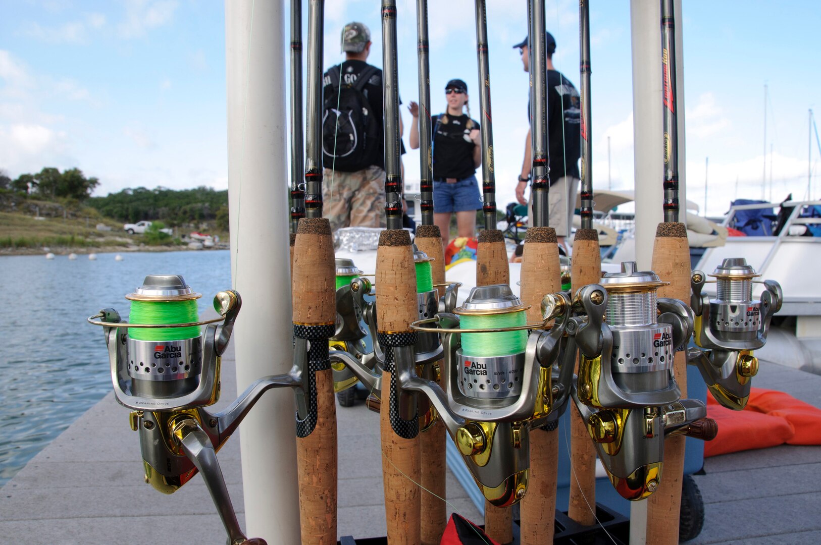 Fishing equipment sits on the dock at Canyon Lake Marina waiting to be loaded by members of the 559th Flying Training Squadron.  The group volunteered Aug. 21 to setup and tear down for Operation Float a Soldier, which provides Wounded Warriors and their family members with a relaxing day of water activities and a barbeque lunch at Canyon Lake.  (U.S. Air Force photo/Steve Thurow)