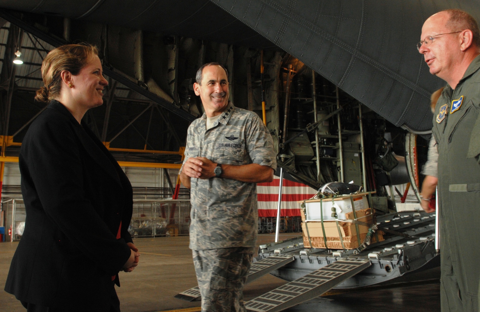Ms. Erin C. Conaton, Under Secretary of the Air Force, and Gen. Raymond E. Johns Jr., Air Mobility Command commander, talk with an Airman from AMC's C-130 Tactics Training Detachment 5 at St. Josephs, Mo., about preparing a C-130 for airdrop missions during Secretary Conaton's visit to Scott Air Force Base, Ill., on Aug. 20, 2010. (U.S. Air Force Photo/Senior Airman Andrew Davis)
