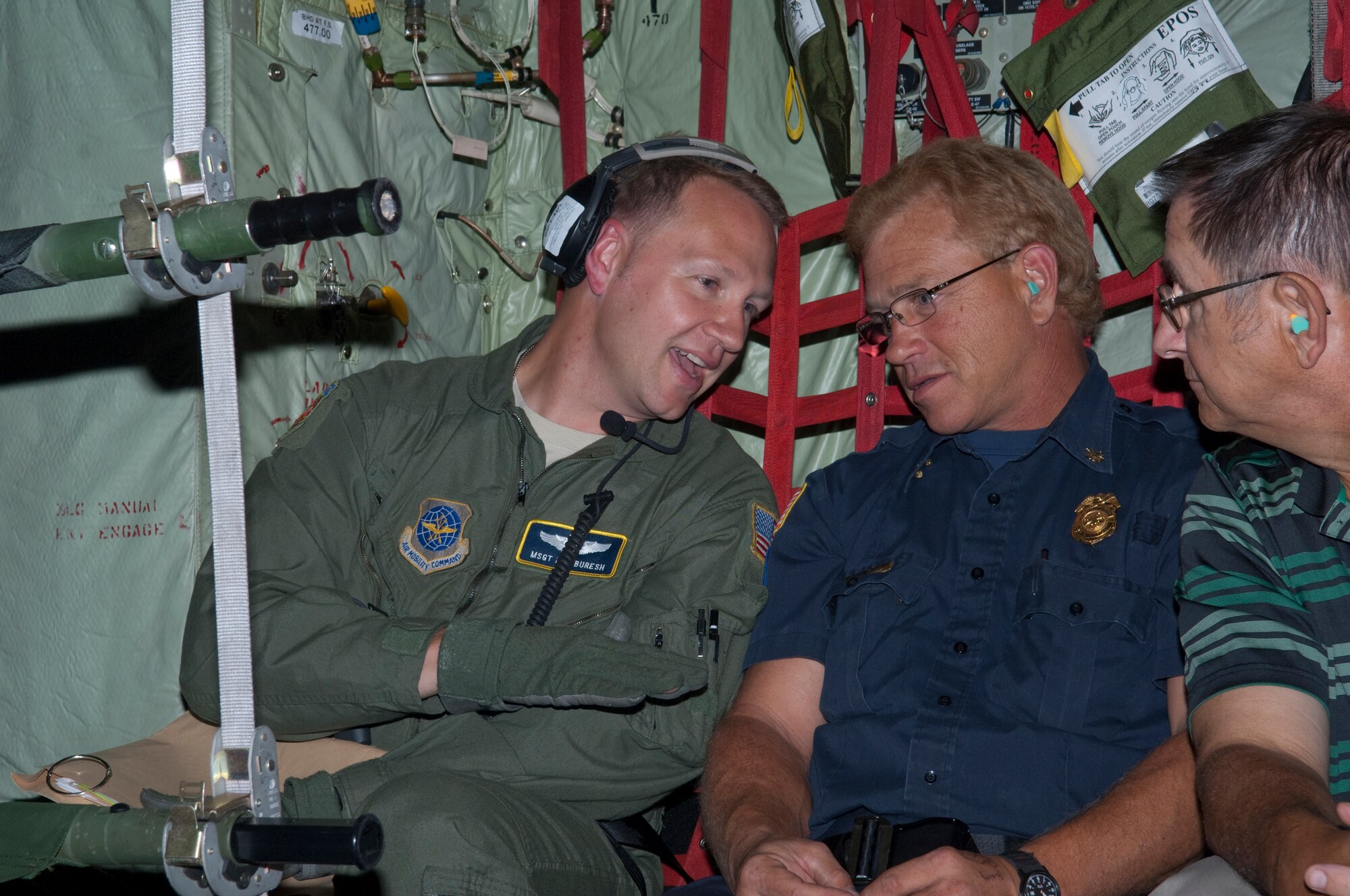 Metropolitan Twin Cities civilian officials talk with an Airman aboard a C-130 "Hercules" as they participate in Metro Mayors Day at the 133rd Airlift Wing on August 19, 2010. The Minnesota National Guard units at the Minneapolis-St. Paul International Airport brought local officials on base and on a flight on a military cargo aircraft to demonstrate the capabilities that could be available once authorized for communities. USAF Official Photo by Senior Master Sgt. Mark Moss