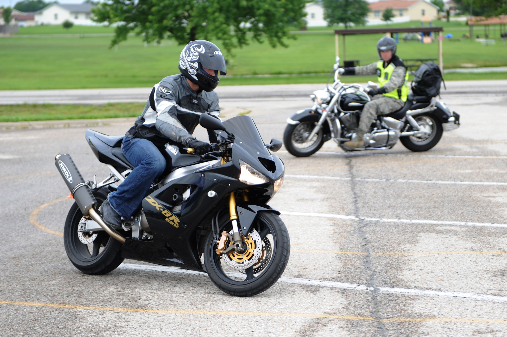 WHITEMAN AIR FORCE BASE, Mo. - Participants of a motorcycle safety expo
navigate the road course, May 21. Motorcycle safety doesn't go as far as
just how well they ride, it also includes the safety gear they wear and how
well they can be seen by other drivers.(U.S. Air Force photo by Senior Airman
Carlin Leslie)

