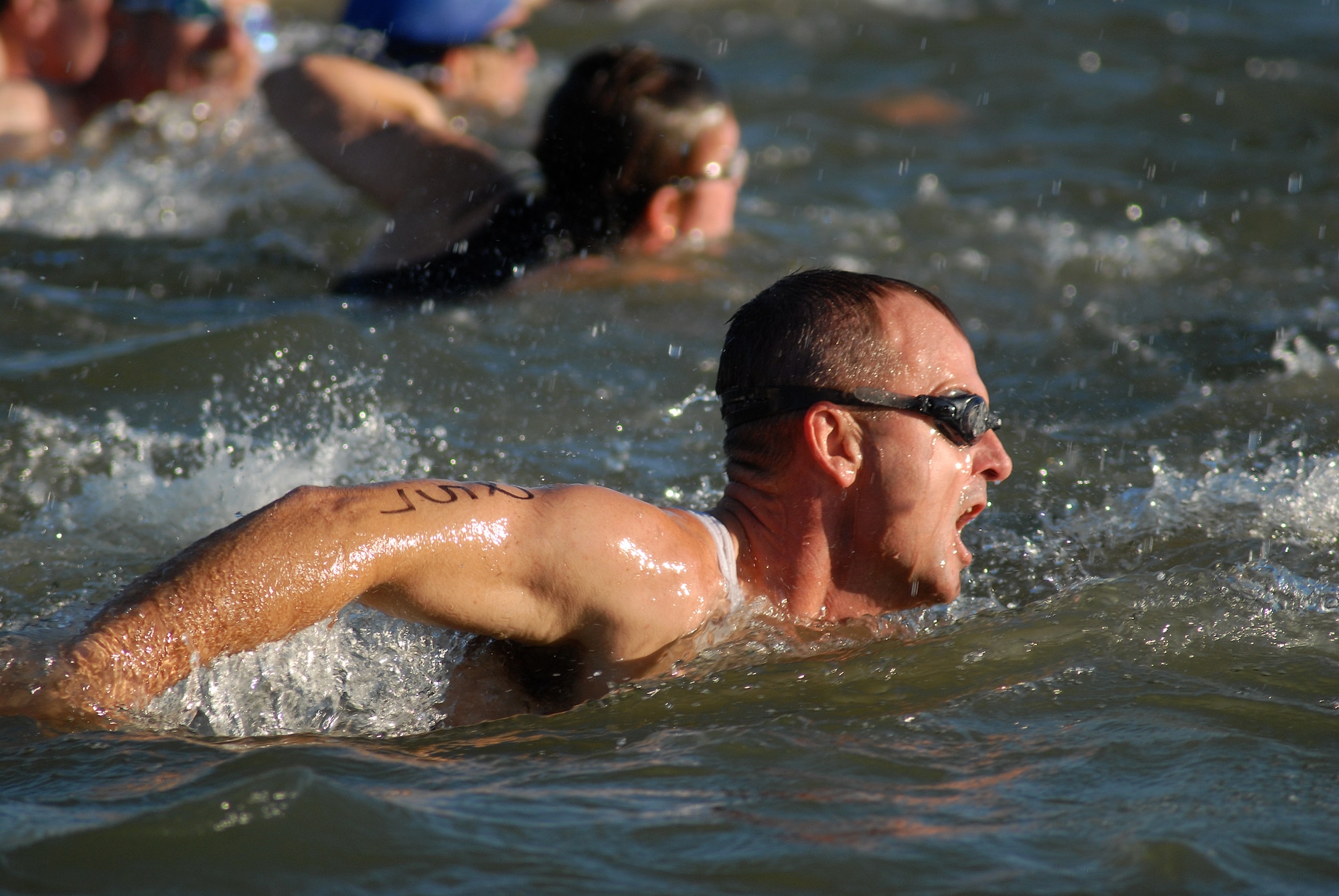 Col. Guy Parker, 17th Support Group commander, swims the first leg of the 400-meter swim during the 2010 Triathlon Aug. 21.  The triathlon, open to military and the community, was comprised of a 400-meter swim, 20-kilometer bike ride, and a 5-kilometer run.  (U.S. Air Force photo/ Master Sgt Randy Mallard)