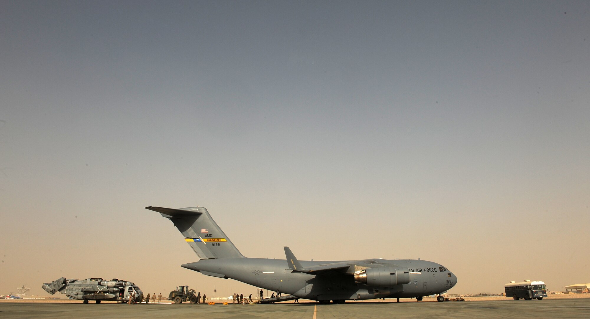 Aircrew assigned to the14th Airlift Squadron and U.S. Marines assigned to the 266th Medium Tilt Rotor Squadron, successful off load MH-53E Super Stallion out of a C-17A Globemaster III aircraft, Aug. 23, 2010 at Camp Bastion, Afghanistan. The mission is in support of the Pakistan flood relief efforts. (U.S. Air Force photo/Staff Sgt. Manuel J. Martinez)