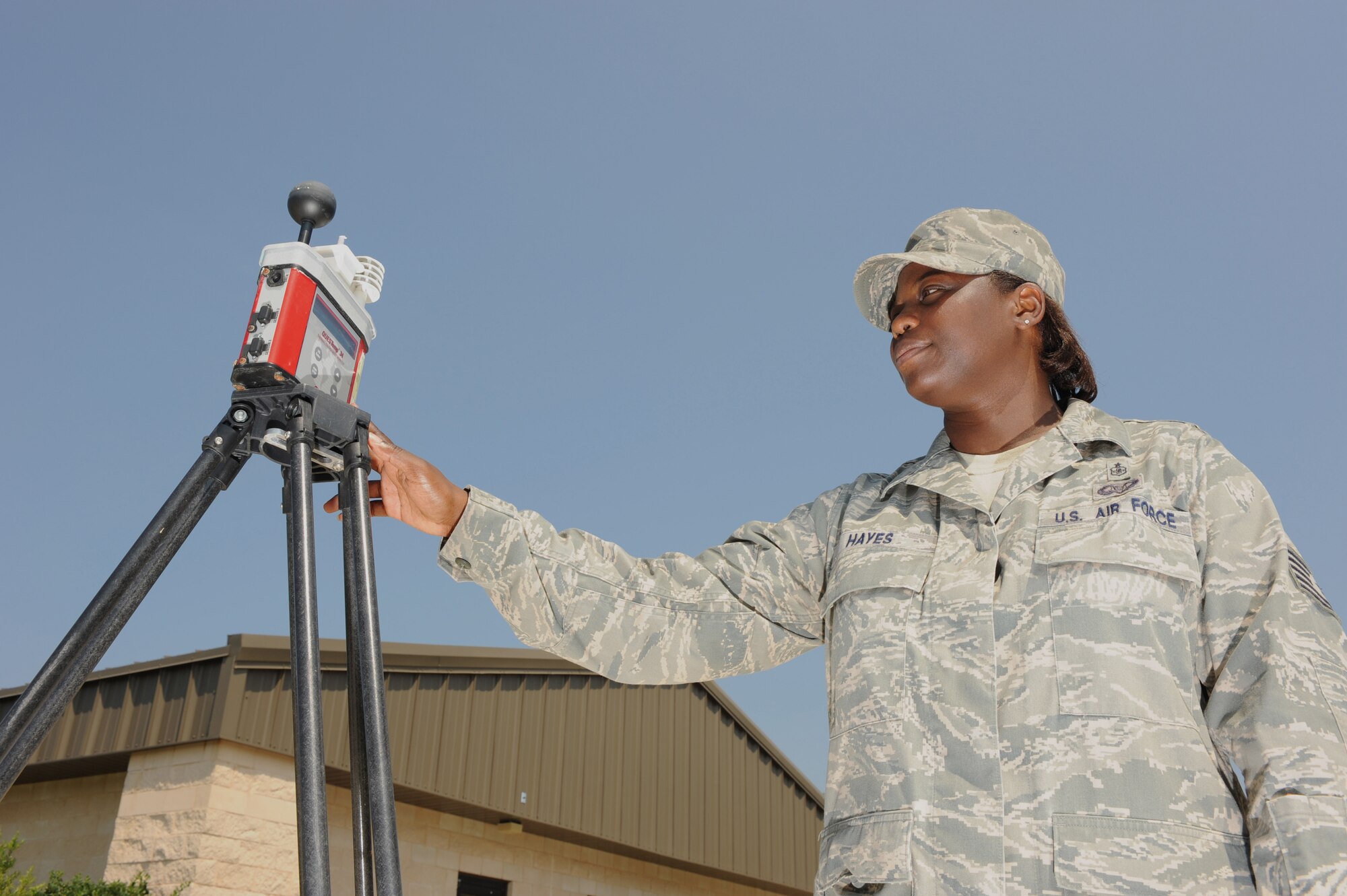 Tech. Sgt. Chloe N. Hayes, 1st Special Operations Aerospace Medicine Squadron Bioenvironmental Engineering Craftsman, is checking the heat stress machine, which helps determine the flag conditions for the base, at Hurlburt Field, Fla., 24 August 2010. (DoD photo by Air Force Airman Caitlin O'Neil-McKeown)