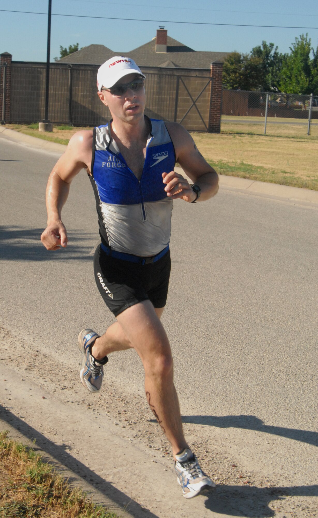 Maj. Michael Goodman, 17th Comptroller Squadron commander, finishes the last leg of the 2010 Triathlon at the Goodfellow Rec Camp Aug. 21. Major Goodman placed third place in the individual category finishing in 1:02:45. Other individual winners were: first place, 2nd Lt. Anda Greeney, 315th Training Squadron, with 0:56:16; and second place, Dan Casbon with 1:01:36. (U.S. Air Force photo/Connie Hempel)