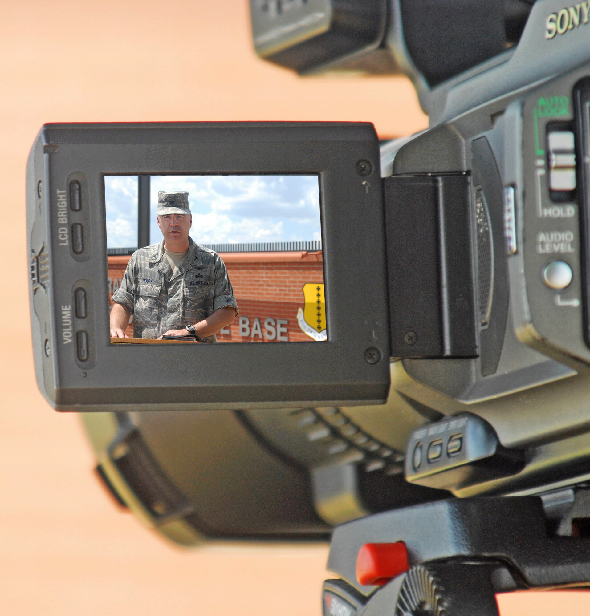 Col. Thomas Geary, 17th Training Wing commander, holds a press conference at the visitor control center with some mock media during the active shooter exercise Aug. 19. (U.S. Air Force photo/Robert Martinez)