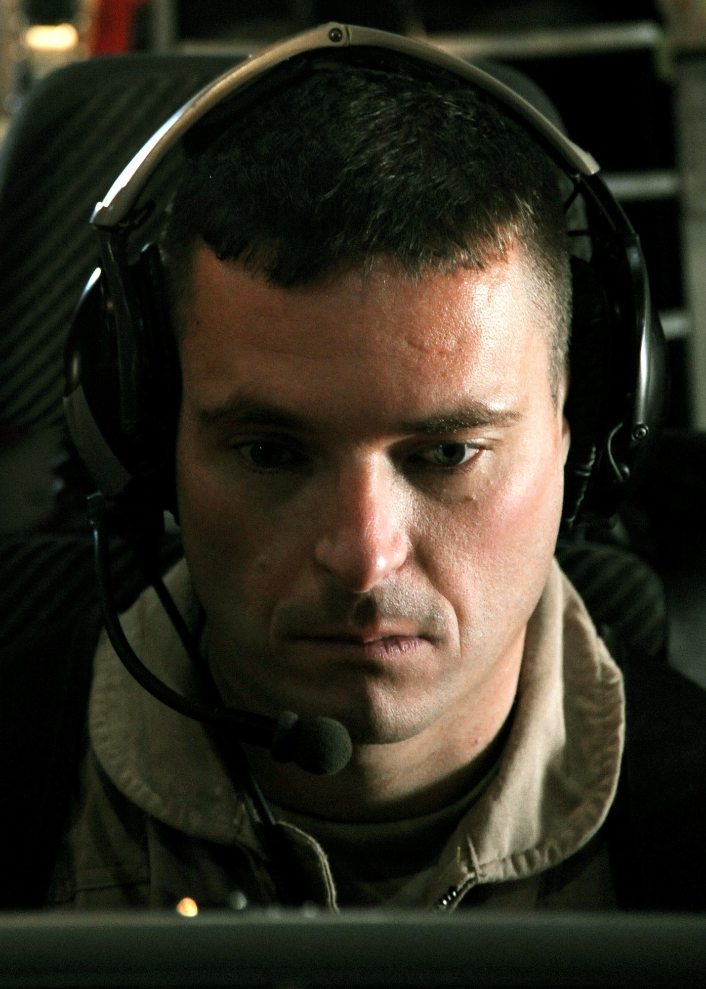 Capt. Jason Davis prepares for a joint airborne battle staff detachment mission on a C-130 Hercules Nov. 24, 2009. The JABS is a joint operation focused on providing airborne communications support to ground forces. Captain Davis is the 777th Expeditionary Airlift Squadron mission commander. (U.S. Air Force photo/Senior Airman Christopher Hubenthal)