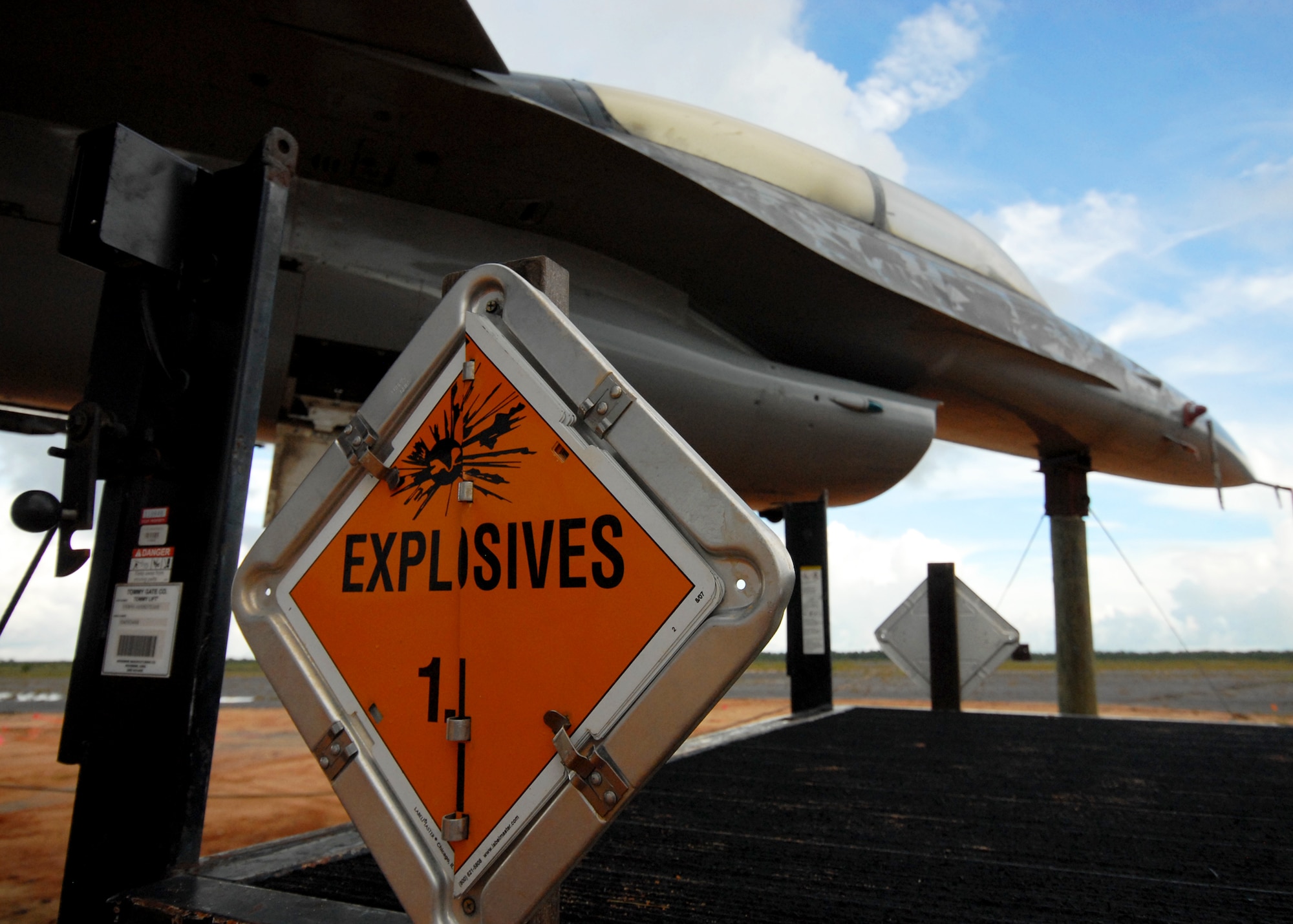 An F-16 Fighting Falcon from the 40th Flight Test Squadron awaits its fiery fate Aug. 19 on the Eglin Air Force Base range.  The aircraft was exploded as part of a test of the flight termination system to be used in the QF-16.  The purpose was to demonstrate that the FTS design will be sufficient to immediately terminate the flight of a QF-16, as well as to determine a range safety debris footprint.  (U.S. Air Force photo/Samuel King Jr.)