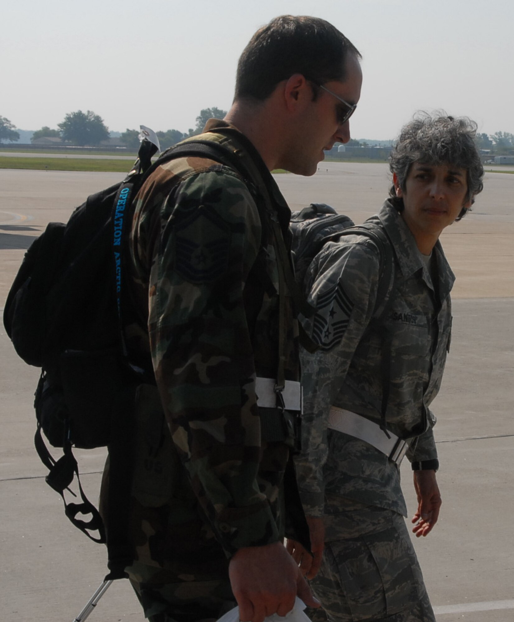 Master Sgt. Brady Kiel shares his thoughts on summer heat and readiness with the highest ranking enlisted leader, Command Chief Master Sgt. Sandra Santos, during a recent training activity at the 932nd Airlift Wing.  (U.S. Air Force photo/Maj. Stan Paregien)