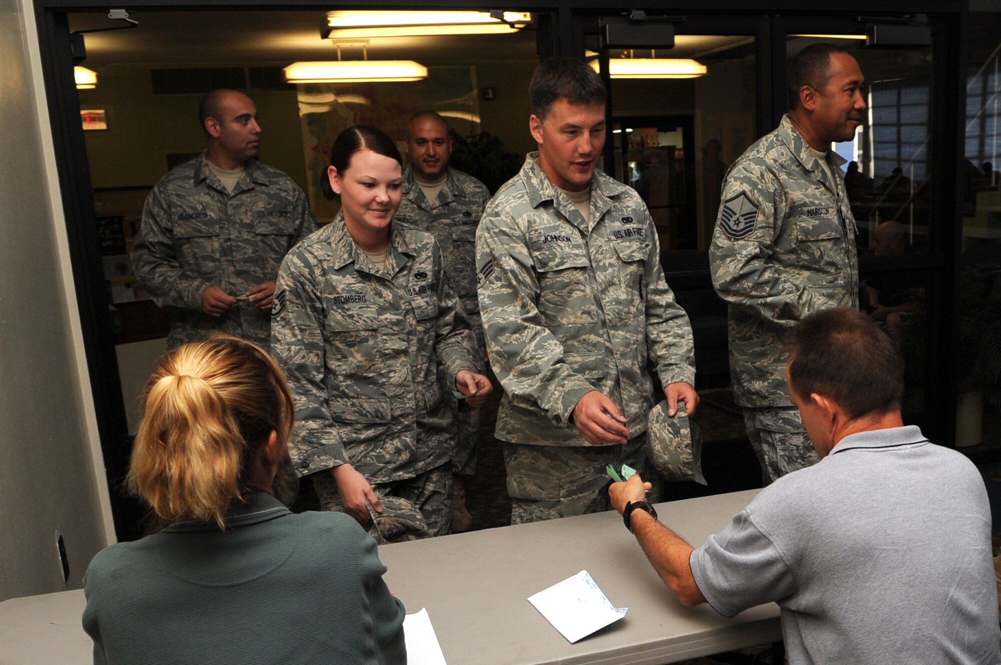 MOUNTAIN HOME AIR FORCE BASE, Idaho -- Gunfighters hand in their tickets during a Chief’s Steak Burn Aug 18. The Chief’s Steak Burn is held seven times during the summer months and the funds are used to assist different organizations on base. (U.S. Air Force photo by Senior Airman Roy Lynch)