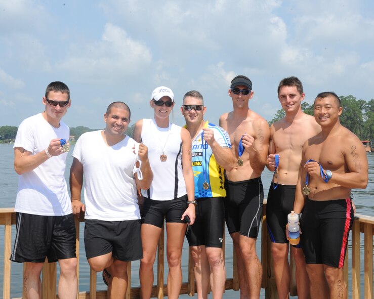 LAKE PARK, Ga. -- Members of the Moody Air Force Base Triathlon Club proudly display medals achieved for the top three standings in the various age and triathlon course categories. (Left to right) Capt. Paul Gesl, 23rd Wing Judge Advocate; Staff Sgt. Paul Merck, Amanda Merck, Col. Randall Richert, 820th Security Forces Group, Capt. Trevor Ambron, 822nd Security Forces Squadron, 1st Lt. Chad Follett, 71st Rescue Squadron, (holding Cathy Deyo's first place medal) and Master Sgt. Sam Louie (holding Mr. Aaron Reed's first place medal). (U.S. Air Force photo/Master Sgt. Stan Coleman)
