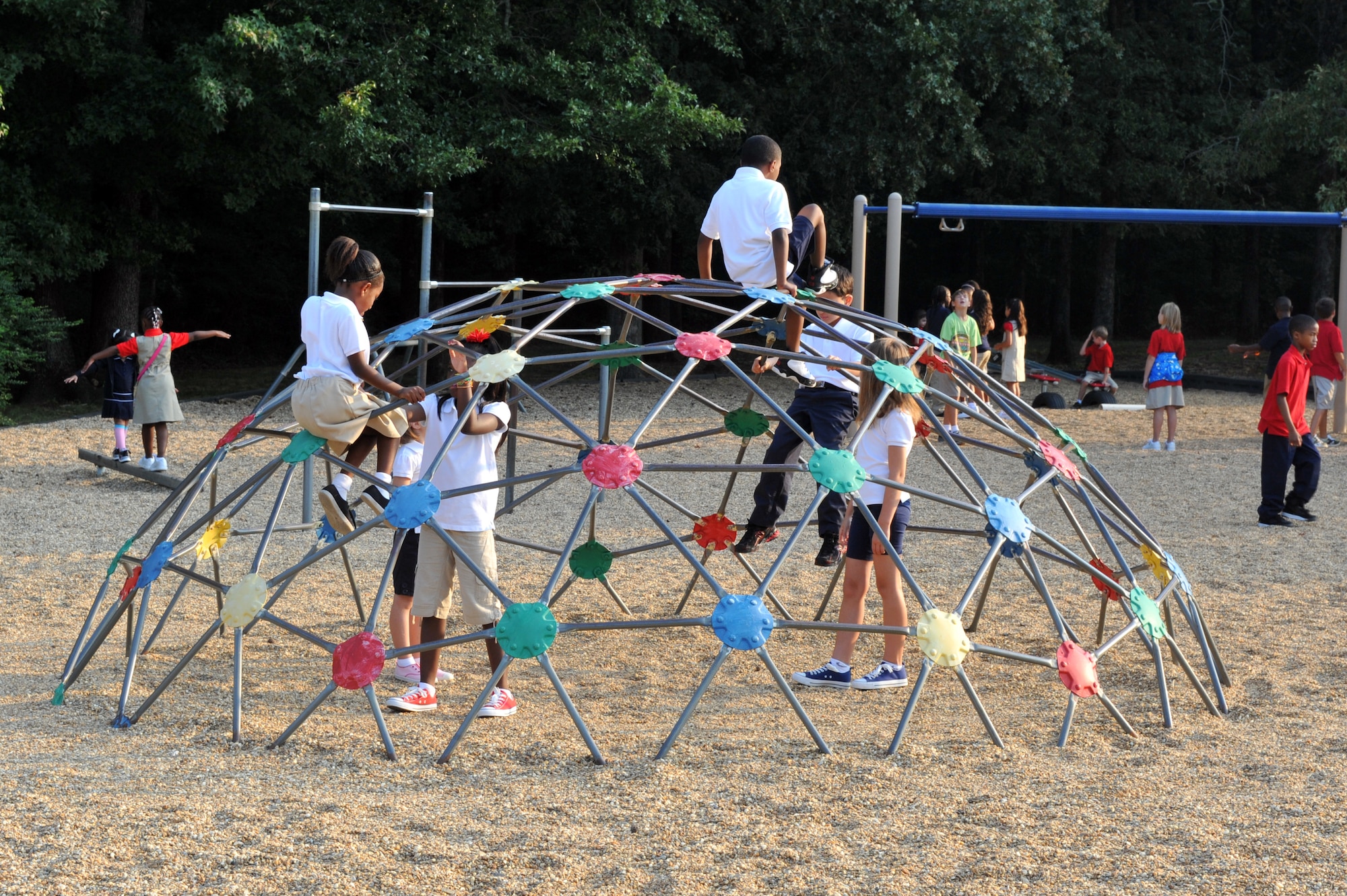 Children play on the playground at Arnold Drive Elementary School Aug. 19 before the first day of school begins. Arnold Drive has changed the time the school day begins to allow the children to have more time to play together and eat breakfast. (U.S. Air Force photo by Staff Sgt. Chris Willis)