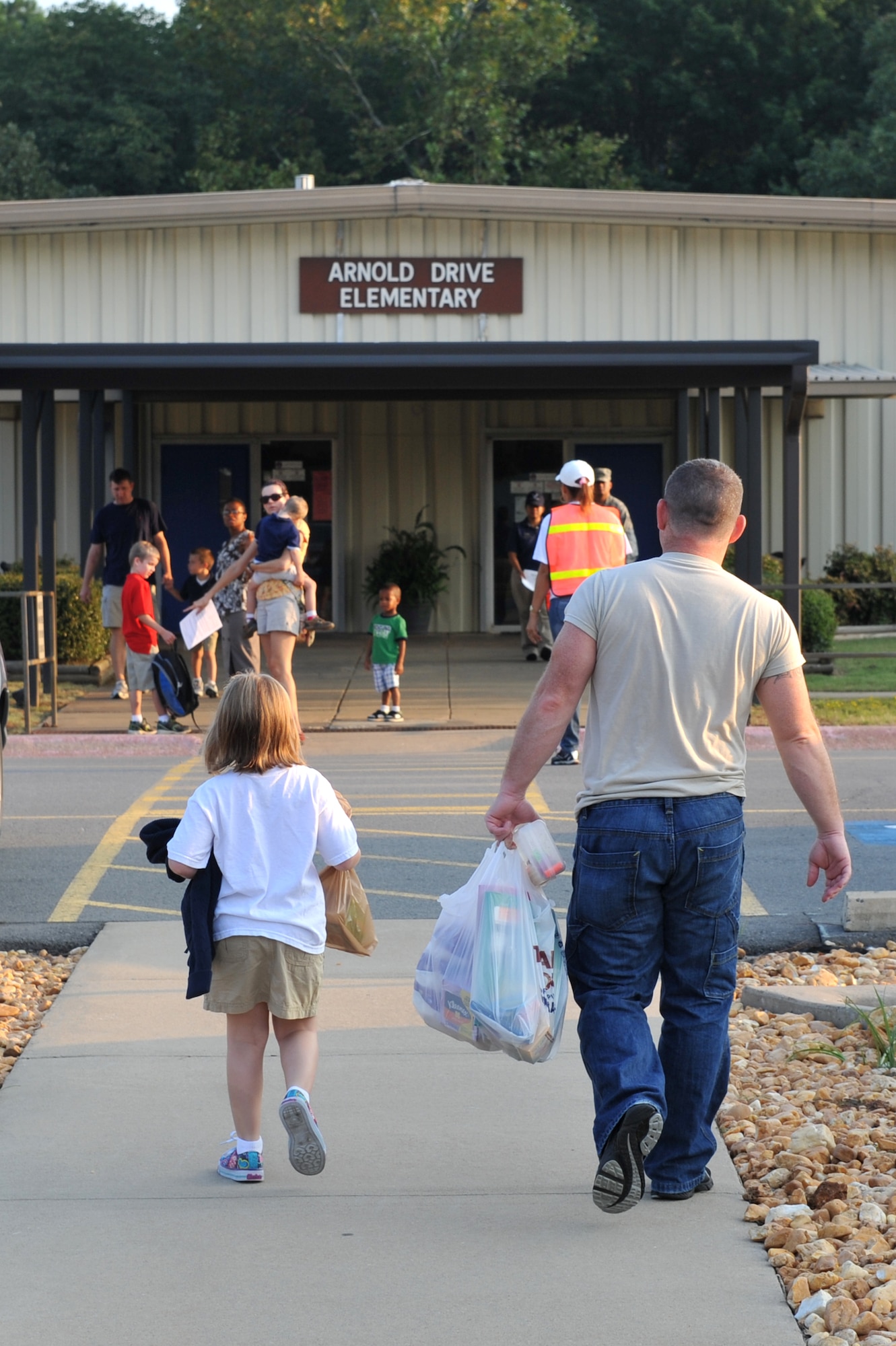 Parents accompany their children to school Aug. 19 on their first day of class for the new school year at Arnold Drive Elementary. The school staff encouraged the parents to come and stay as long as necessary for the children to feel comfortable. (U.S. Air Force photo by Staff Sgt. Chris Willis)