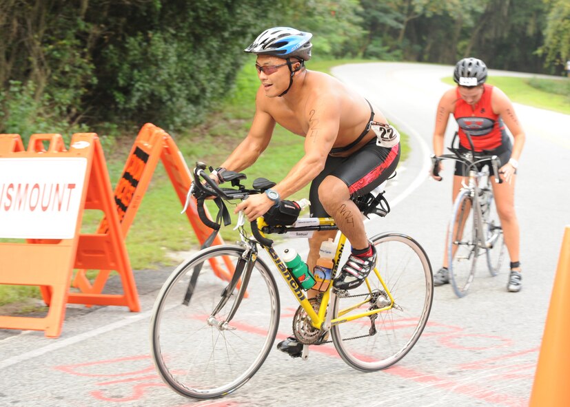 LAKE PARK, Ga. -- Master Sgt. Sam Louie, 820th Combat Operations Squadron from Moody Air Force Base, Ga., takes off to complete the 27-mile biking event during the Winnersville Sprint and Titletown Olympic Triathlon here Aug. 21. Sergeant Louie placed fifth in the 40 to 44 age category with a total time of 2:35:59. (U.S. Air Force/Master Sgt. Stan Coleman)
