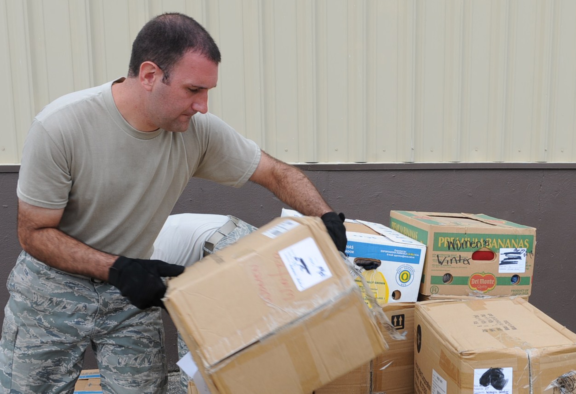GOLDSBORO, N.C. -- Staff Sgt. Justin Smilo organizes pallets of donated food and clothing at the MERCI Mission Center Aug. 20, 2010. The pallets will go to Afghanistan for distribution during humanitarian missions. Sergeant Smilo, 4th Logistic Readiness Squadron air terminal operations, hails from Easton, Conn. (U.S. Air Force photo/Senior Airman Gino Reyes)