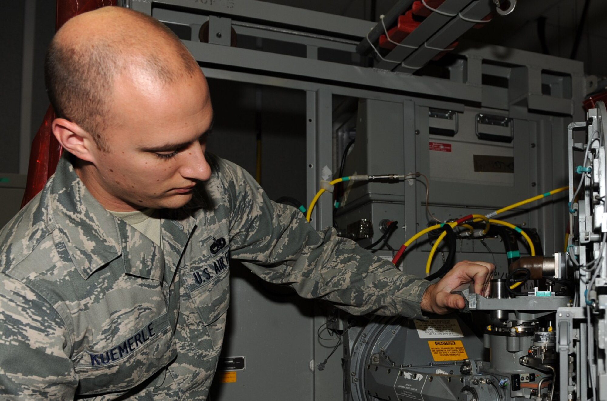 SEYMOUR JOHNSON AIR FORCE BASE, N.C. -- Staff Sgt. Timothy Kuemerle inspects an O31 device here Aug. 20, 2010. The O31 is part of the F-15E Strike Eagle radar package that allows the antenna to function properly. Sergeant Kuemerle, 4th Component Maintenance Squadron avionics back-shop technician, hails from Canton, Ohio. (U.S. Air Force photo/Senior Airman Gino Reyes)