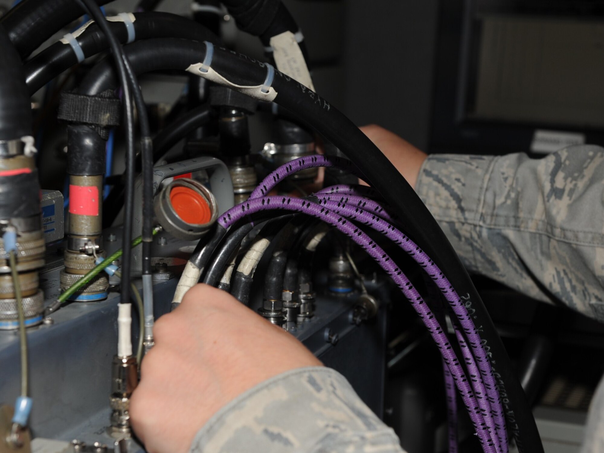 SEYMOUR JOHNSON AIR FORCE BASE, N.C. -- Airman 1st Class Robert Lauber performs a test on an O25 here Aug. 20, 2010. An O25 is a signal receiver on an F-15E Strike Eagle targeting system. Airman Lauber, 4th Component Maintenance Squadron avionics back-shop technician, hails from Dover, Del. (U.S. Air Force photo/Senior Airman Gino Reyes)