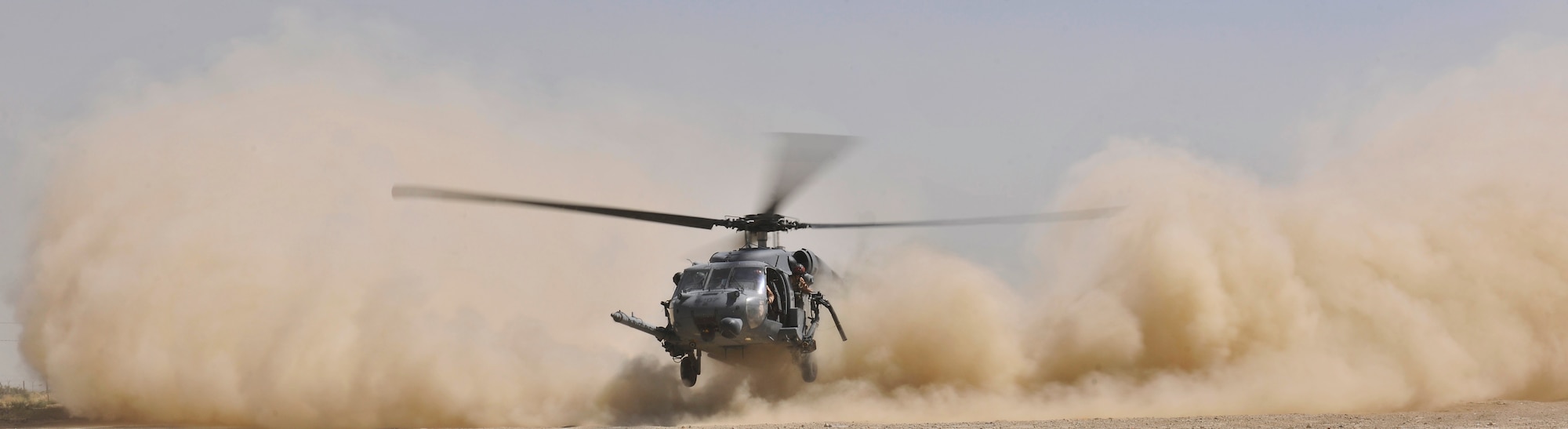 An HH-60G Pave Hawk helicopter landing creates a massive dust cloud during an exercise at Bagram Airfield, Afghanistan, Aug. 21. 2010. The exercise tested the rescue squadron?s ability to provide medical aid to U.S. and Coalition forces. (U.S. Air Force photo/Staff Sgt. Christopher Boitz)