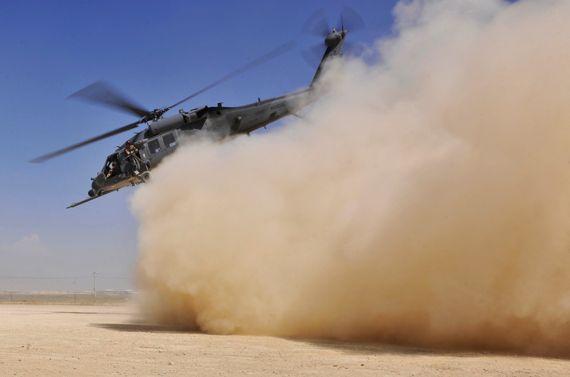 An HH-60G Pave Hawk helicopter carrying simulated wounded takes off from a landing zone during an exercise at Bagram Airfield, Afghanistan, Aug. 21. 2010. The exercise tested the rescue squadron?s ability to provide medical aid to U.S. and Coalition forces.  (U.S. Air Force photo/Staff Sgt. Christopher Boitz)