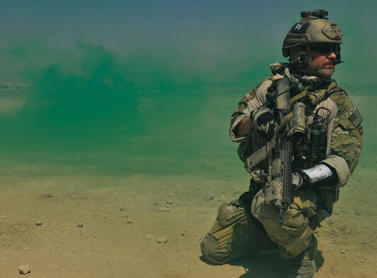A pararescueman secures a sector of the landing zone before assisting simulated injured personnel during an exercise at Bagram Airfield, Afghanistan, Aug. 21. 2010. The exercise tested the rescue squadron?s ability to provide medical aid to U.S. and Coalition forces. (U.S. Air Force photo/Staff Sgt. Christopher Boitz)