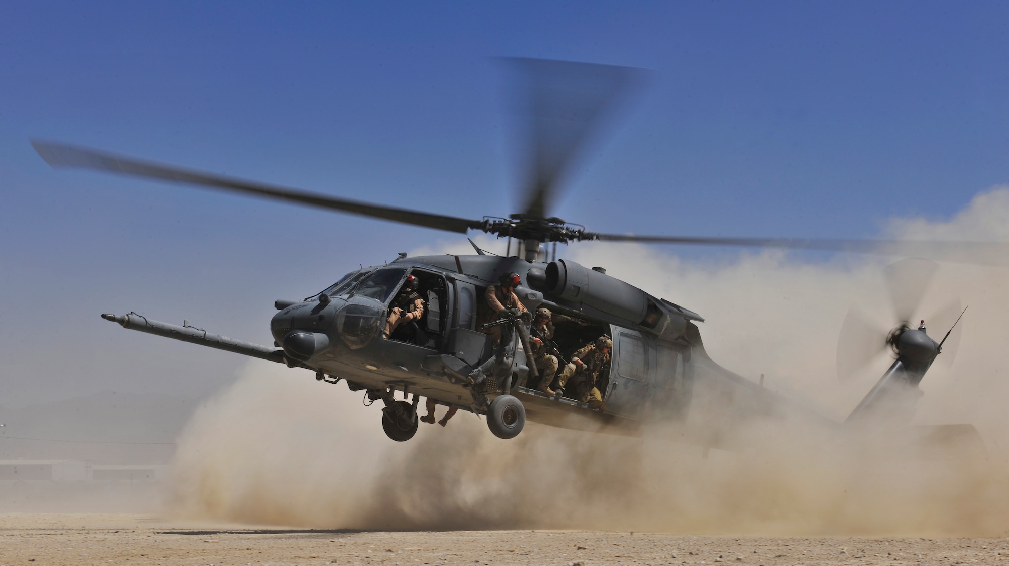 An HH-60G Pave Hawk helicopter carrying combat search and rescue Airmen approaches a landing zone during an exercise at Bagram Airfield, Afghanistan, Aug. 21. 2010. The exercise tested the rescue squadron?s ability to provide medical aid to U.S. and Coalition forces. (U.S. Air Force photo/Staff Sgt. Christopher Boitz) 