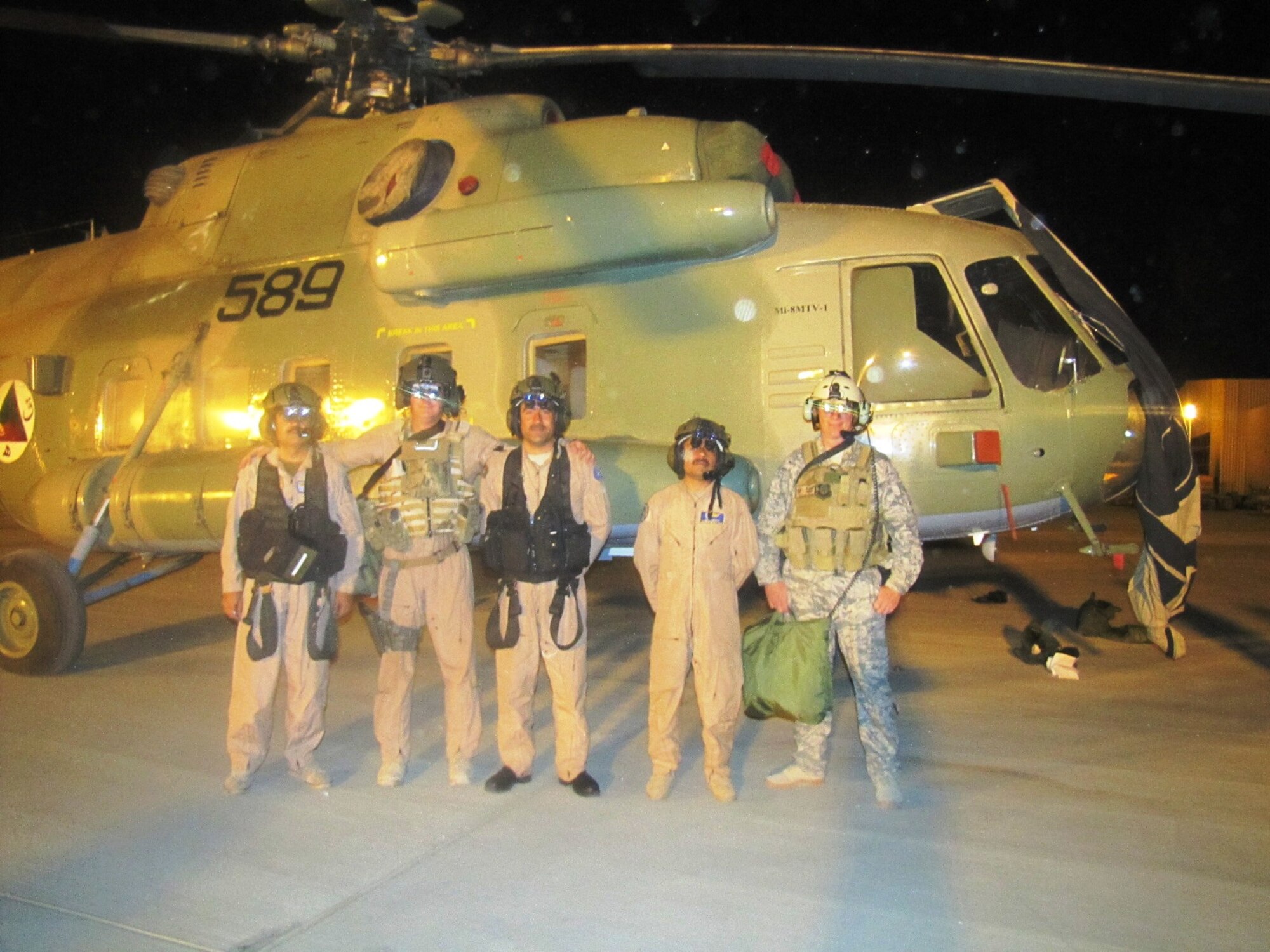 KABUL, Afghanistan - Afghan Air Force aircrew and their 438th AEW advisors pose for a photo after their night flight with the aid of night vision goggles for the first time in Afghanistan in the Mi-17 Transport helicopter on Aug. 22, 2010. (U.S. Air Force photo by Capt. Rob Leese/RELEASED).