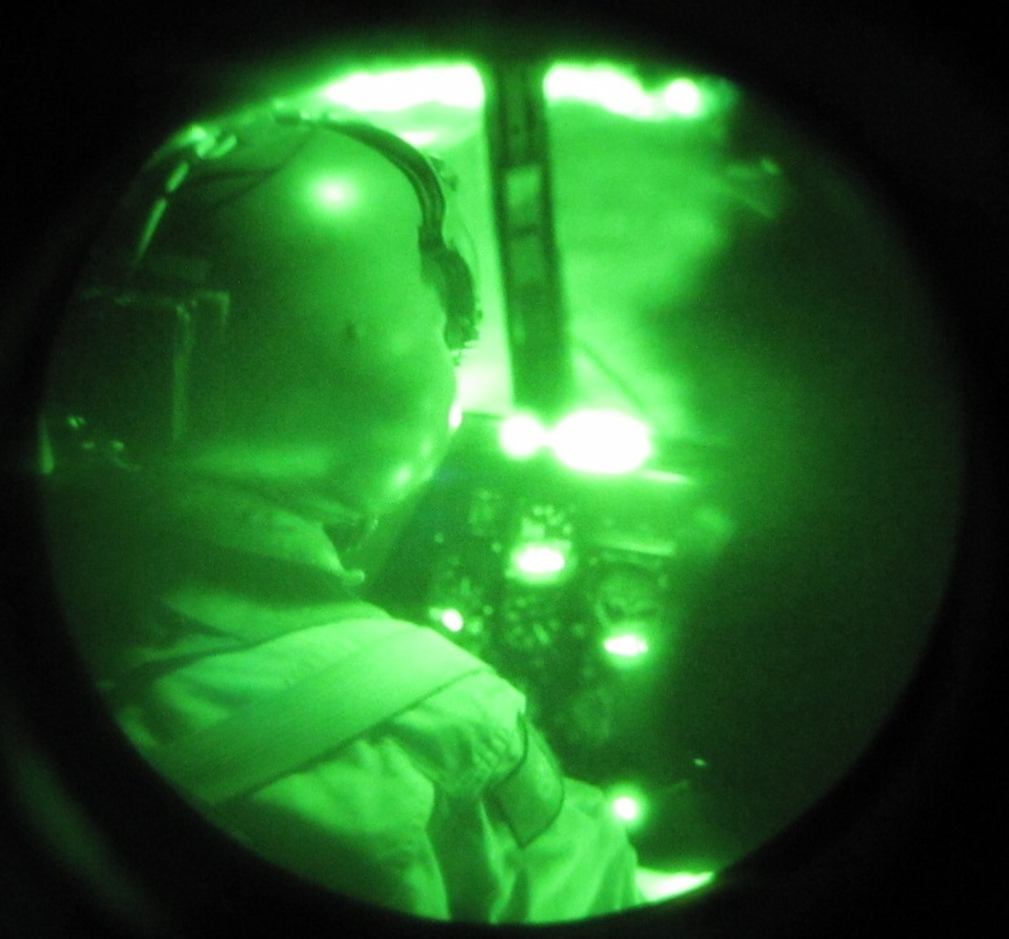 KABUL, Afghanistan - Afghan Air Force pilot flies with the aid of night vision goggles for the first time in Afghanistan in the Mi-17 Transport helicopter on Aug. 22, 2010. (U.S. Air Force photo by Capt. Rob Leese/RELEASED).