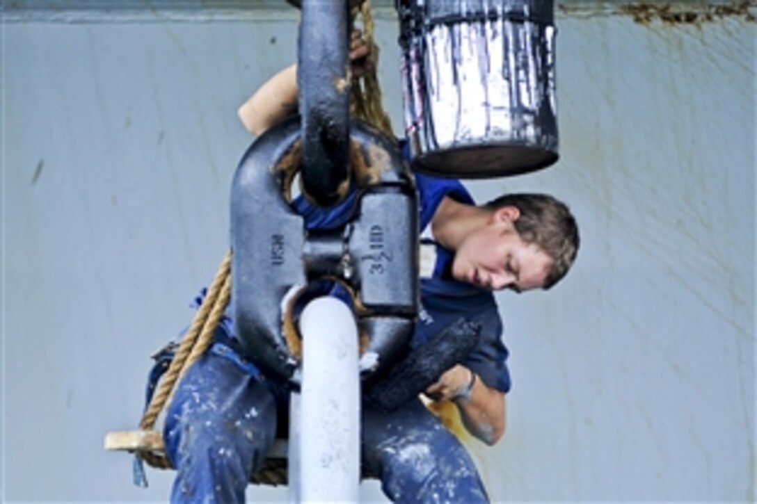 U.S. Navy Seaman Jacklyn Cravey paints the anchor of the USS Iwo Jima while the ship is ported in Limon, Costa Rica, Aug. 23, 2010. The Iwo Jima is in Costa Rica supporting Continuing Promise, a humanitarian and civic assistance mission to provide medical, dental, veterinary, engineering assistance to several nations.