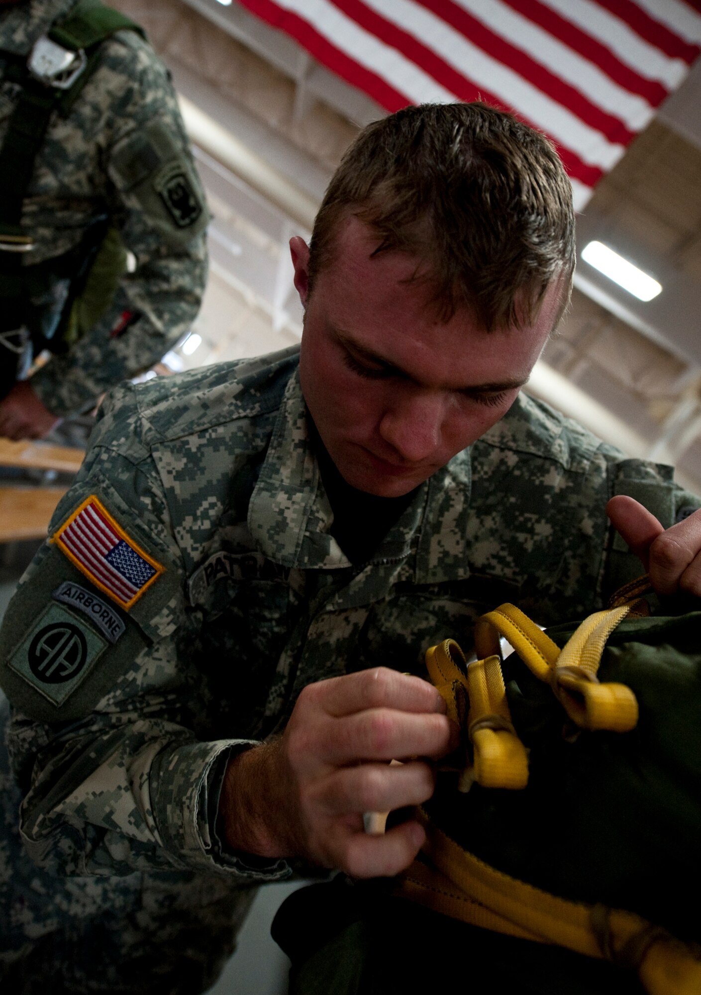 JOINT BASE ELMENDORF-RICHARDSON, Alaska -- A Soldier prepares for a jump Aug. 24. Approximately 50 members of the 425th Brigade Special Troops Battalion participated in a three-week path finder course at Joint Base Elmendorf-Richardson. Instruction included sling load operations, helicopter landing and pickup zone operations along with drop zone operations. (Photo by Airman 1st Class Christopher Gross)