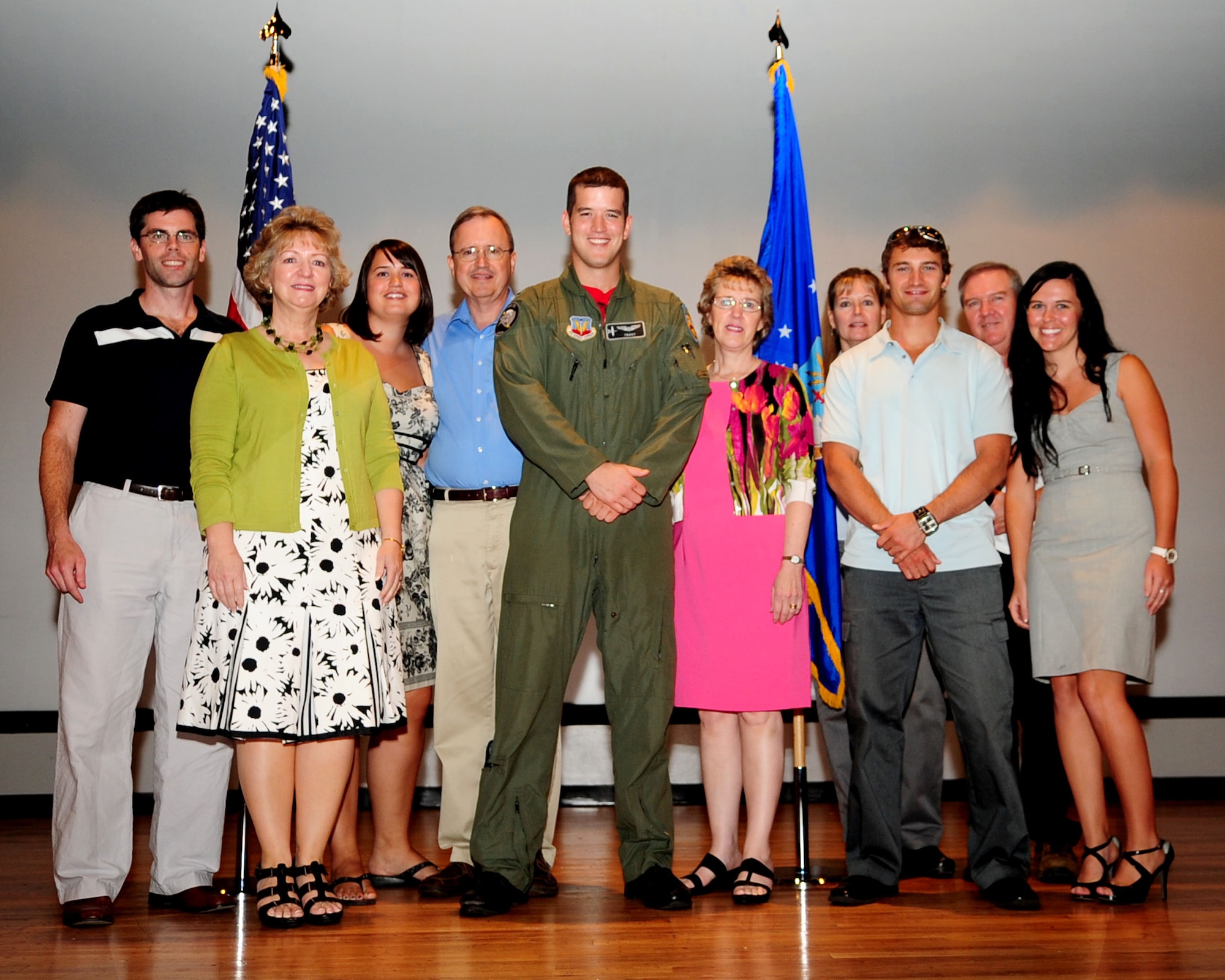 1st Lt. Dan Griffin, center, poses with his family after the graduation ceremony for A-10C Pilot Initial Qualification Course Class 10-BBD at the base theater here Aug. 13, 2010. Lieutenant Griffin was one of 12 students to most recently complete the 27-week training course, becoming the Air Force’s newest A-10C pilots. (U.S. Air Force photo/Airman 1st Class Jerilyn Quintanilla)