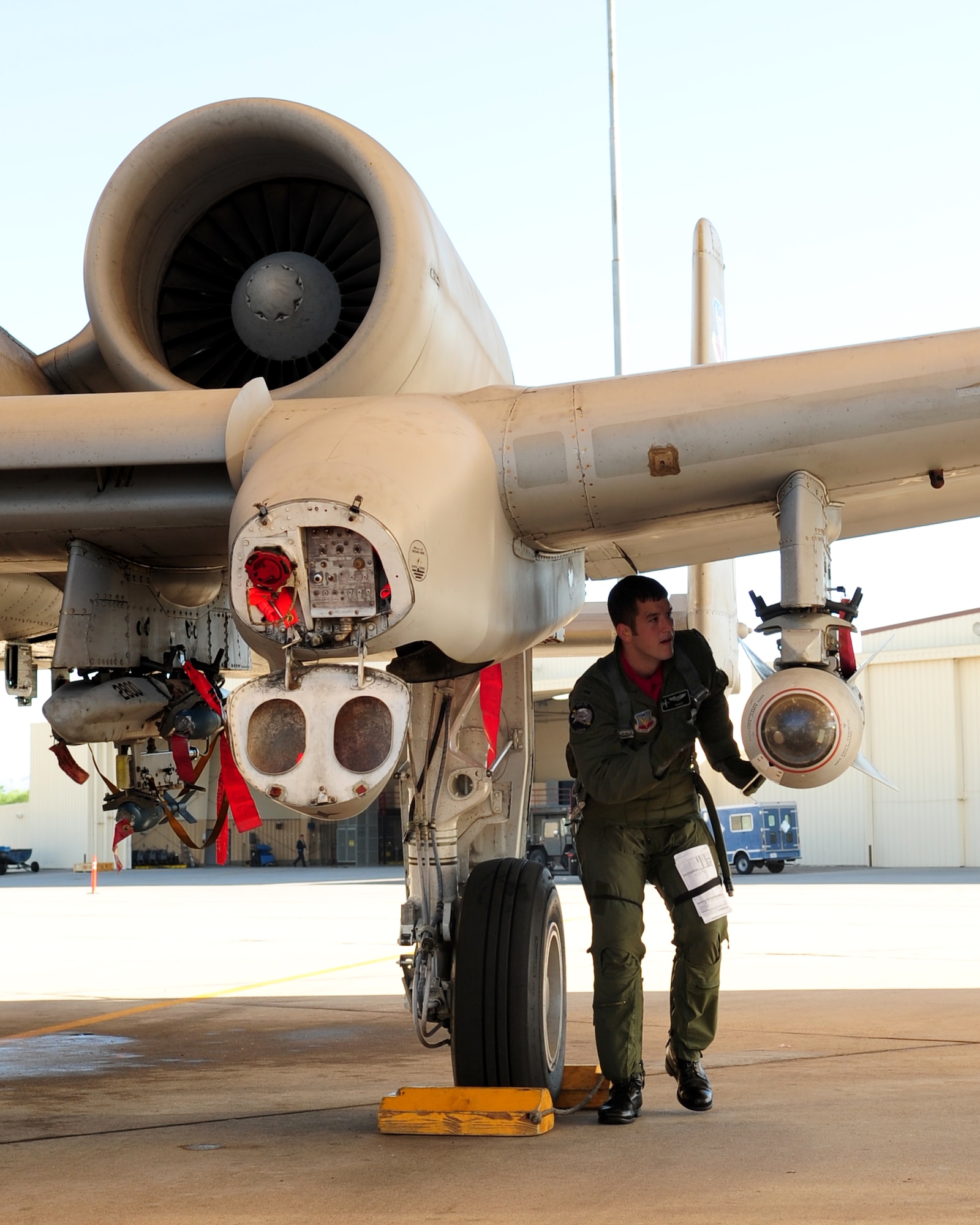 1st Lt. Dan Griffin, a 358th Fighter Squadron pilot, checks his aircraft on the flight line here before taking off for his final training sortie Aug. 13, 2010. It was the last milestone in his 27-week A-10C Pilot Initial Qualification Course. (U.S. Air Force photo/Airman 1st Class Jerilyn Quintanilla)