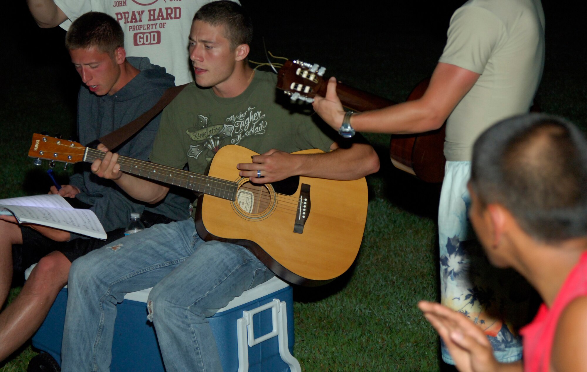 Airman 1st Class Will Smith, 22nd Aircraft Maintenance Squadron communication and navigation apprentice, and Airman Christopher Novak, 22nd Operational Support Squadron aircrew flight equipment apprentice, participate in worship at El Dorado Lake, Aug. 21, 2010. The Airmen spent a day on the waters of El Dorado during a retreat hosted by the base chapel. McConnell’s Chapel has hosted several retreats for all demographics of McConnell since 2008. (U.S. Air Force photo/Airman 1st Class Armando A. Schwier-Morales)