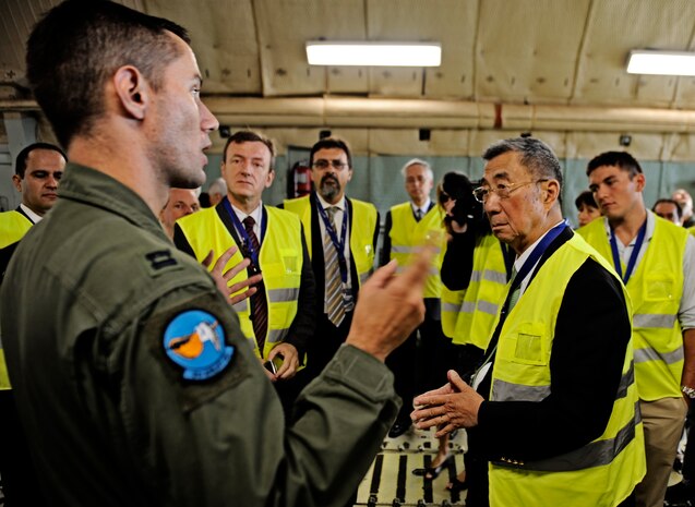 GENEVA, Switzerland -- Capt. Cory Damon, 9th Airlift Squadron C-5M  pilot based out of Dover AFB, Delaware, speaks to scientists and engineers August 25 at Geneva Switzerland airport, about the C-5M Super Galaxy and how it is the perfect choice for transporting their Alpha Magnetic Spectrometer. The AMS is the brain child of Nobel Laureate, Professor Samuel Ting and has been in production over the last 16 years. The purpose of the experiment is to detect and analyze particles found in space while docked to the International Space Station. According to Prof. Ting, this should help us better understand the universe and how it was created. (U.S. Air Force photo/ Staff Sgt. Ryan Crane)