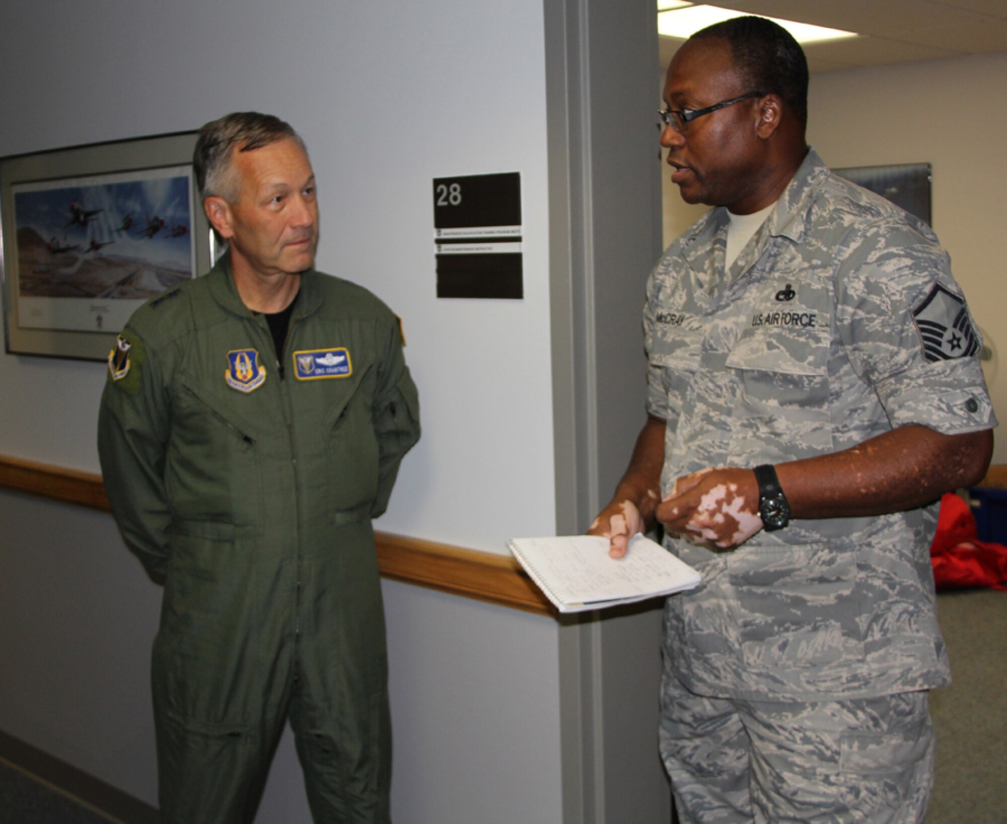 932nd Maintenance Squadron supervisor of the maintenance operation control center, Master Sgt. Ken McCray, briefs details regarding various self-help projects and building upgrades to the commander of Fourth Air Force, Maj. Gen. Eric Crabtree during the August drill weekend.  The 932nd Airlift Wing falls under Fourth Air Force which is located at March Air Force Base, Ca.  (U.S. Air Force photo/Tech. Sgt. Chris Parr)