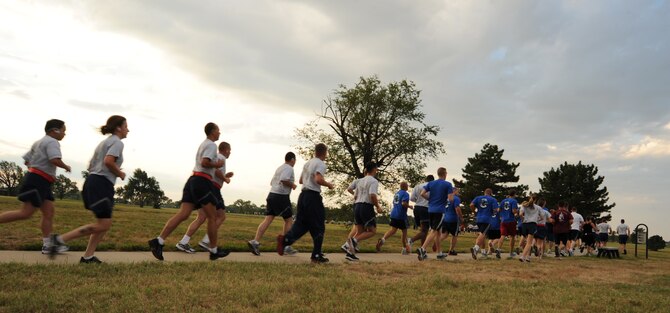 McConnell Airmen and family members run at the Krueger Recreation Area Aug. 20, 2010, McConnell Air Force Base, Kan. The wing fun run is held monthly and is a voluntary, self-paced 5K run through the Krueger Recreation Area and base track.  More than 40 McConnell members will participate with 10,000 registered runners during the 2010 Air Force Marathon Sept. 18. (U.S. Air Force photo/Senior Airman Maria Ruiz)
