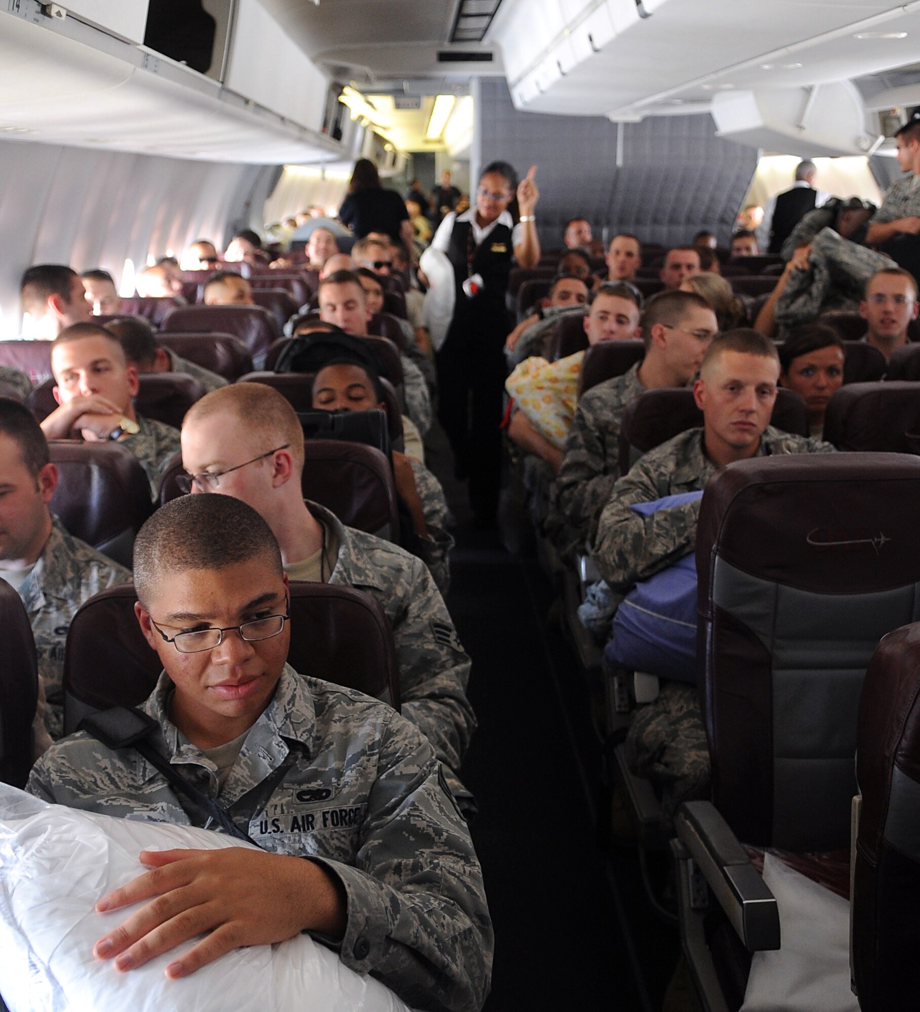 SEYMOUR JOHNSON AIR FORCE BASE, N.C. – Airmen with the 336th Fighter Squadron prepare for take-off on an aircraft enroute to support Operation Enduring Freedom Aug. 22, 2010. These Airmen are support personnel, maintainers, pilots, and weapons system officers who are deploying to execute a close air support mission from Bagram Airfield, Afghanistan. (U.S. Air Force photo/Senior Airman Makenzie Lang)