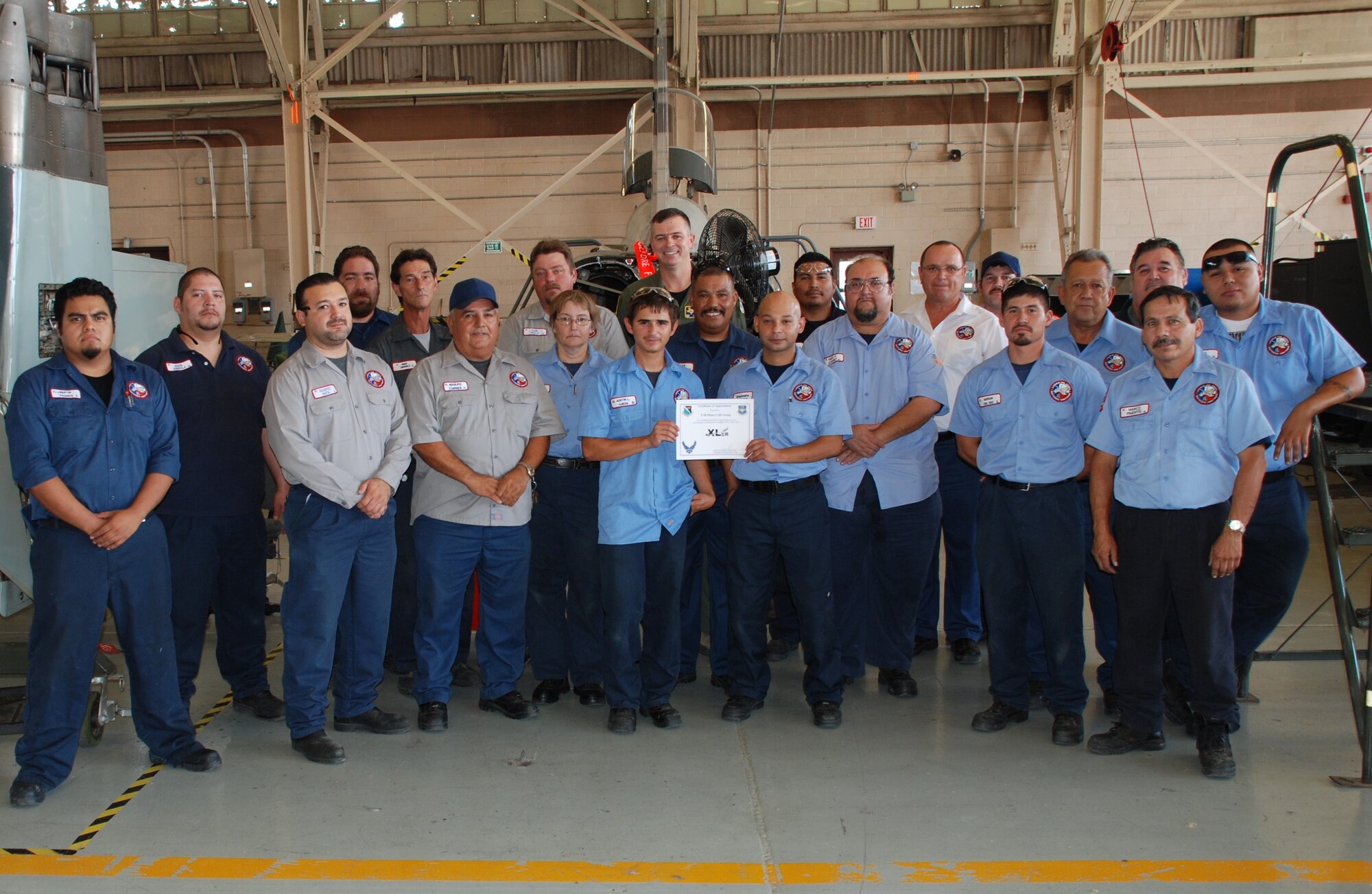 LAUGHLIN AIR FORCE BASE, Texas – The T-38 Phase Cell Group, of the 47th Maintenance Directorate, poses with Col. Craig Wills, 47th Operations Group commander, after the entire unit was presented the XLer of the Week award August 18. Among other things, the group’s leadership said they continually go above and beyond to ensure future pilots fly the safest aircraft possible. The XLer is a weekly award chosen by 47th FTW leadership and given to those who consistently make outstanding contributions to Laughlin and their unit. (U.S. Air Force photo by Airman 1st Class Blake Mize)
