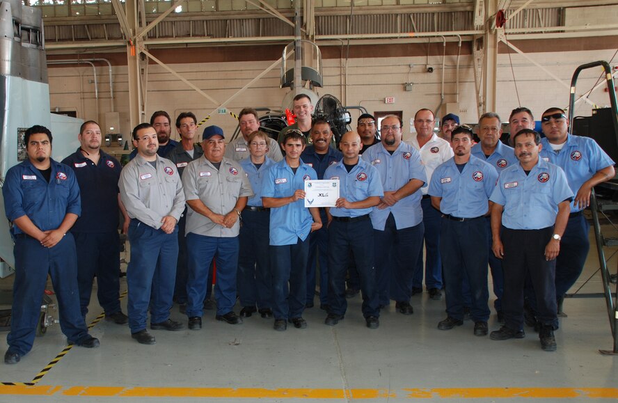 LAUGHLIN AIR FORCE BASE, Texas – The T-38 Phase Cell Group, of the 47th Maintenance Directorate, poses with Col. Craig Wills, 47th Operations Group commander, after the entire unit was presented the XLer of the Week award August 18. Among other things, the group’s leadership said they continually go above and beyond to ensure future pilots fly the safest aircraft possible. The XLer is a weekly award chosen by 47th FTW leadership and given to those who consistently make outstanding contributions to Laughlin and their unit. (U.S. Air Force photo by Airman 1st Class Blake Mize)