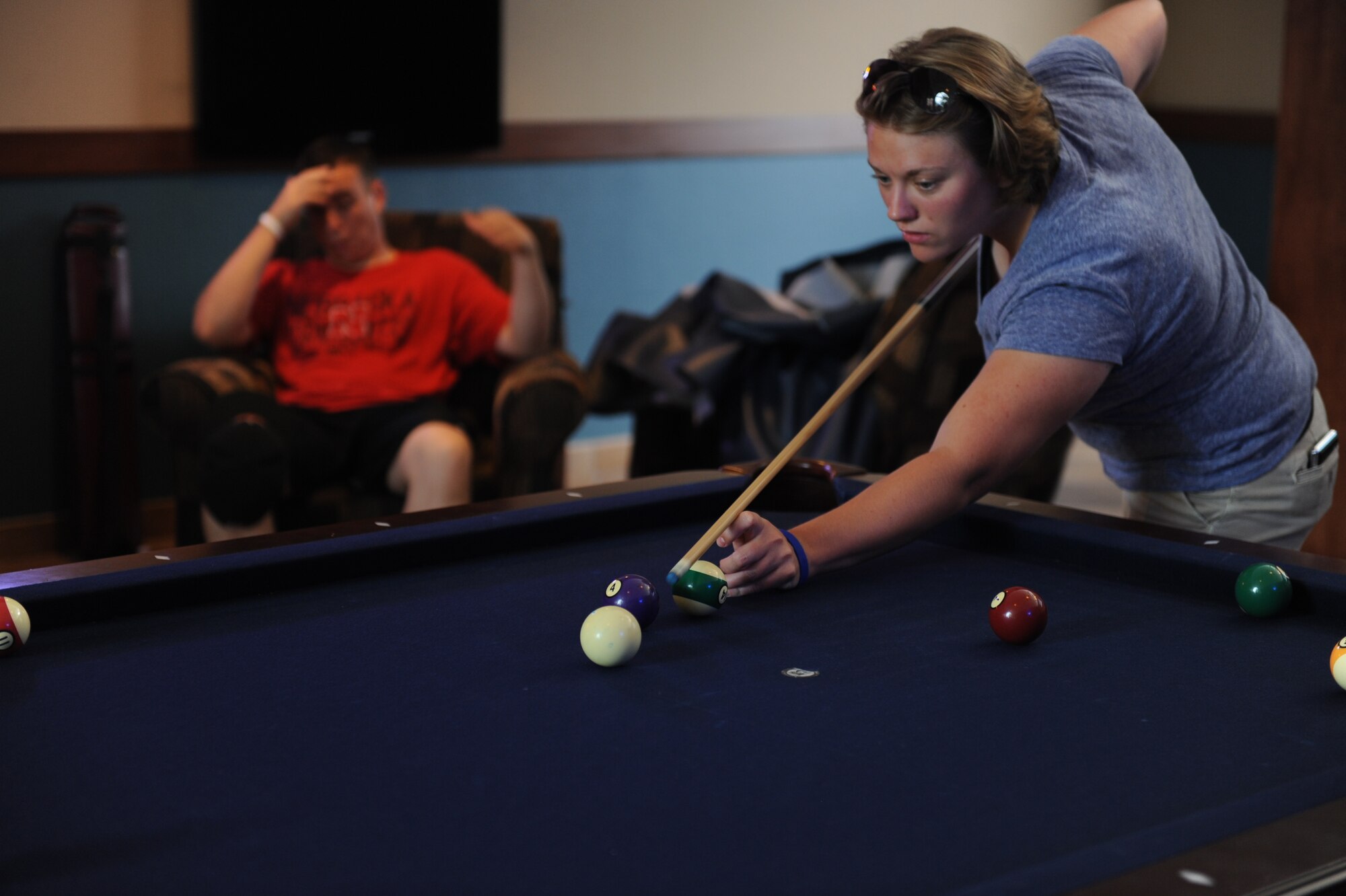 SCOTT AIR FORCE BASE, Ill. -- Airman 1st Class Tristin Atwood, 15th Operational Weather Squadron weather forecaster, shoots pool during the pool tournament.  The Belleville Dorms came in first place during the pool tournament. (U.S. Air Force photo/Senior Airman Tristin English)