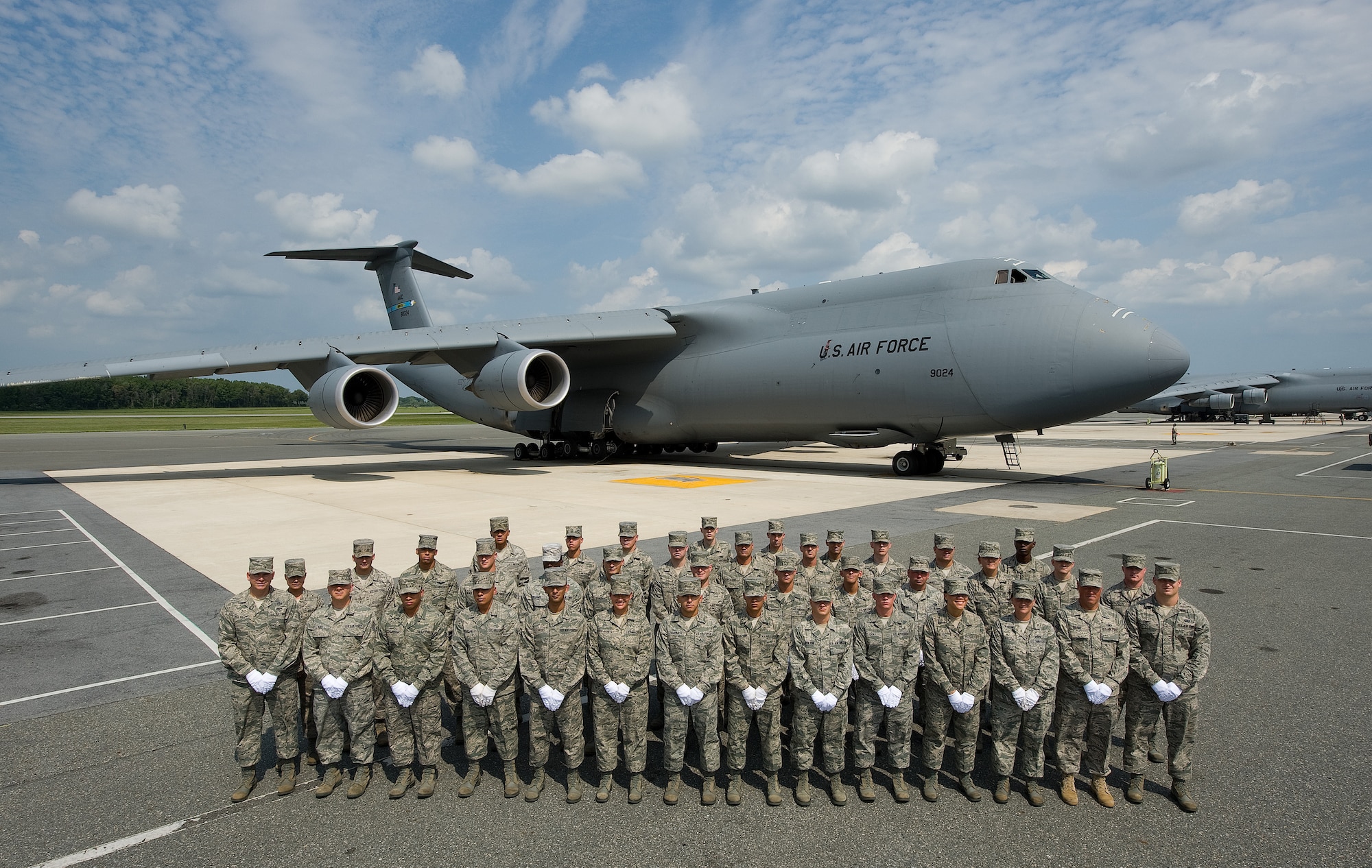 Members of the Dover Air Force Base Honor Guard Class 2010K stand in front of a C-5M at the flight line on Dover Air Force Base, Del., Aug. 16, 2010. (U.S. Air Force photo by Jason Minto/Released)