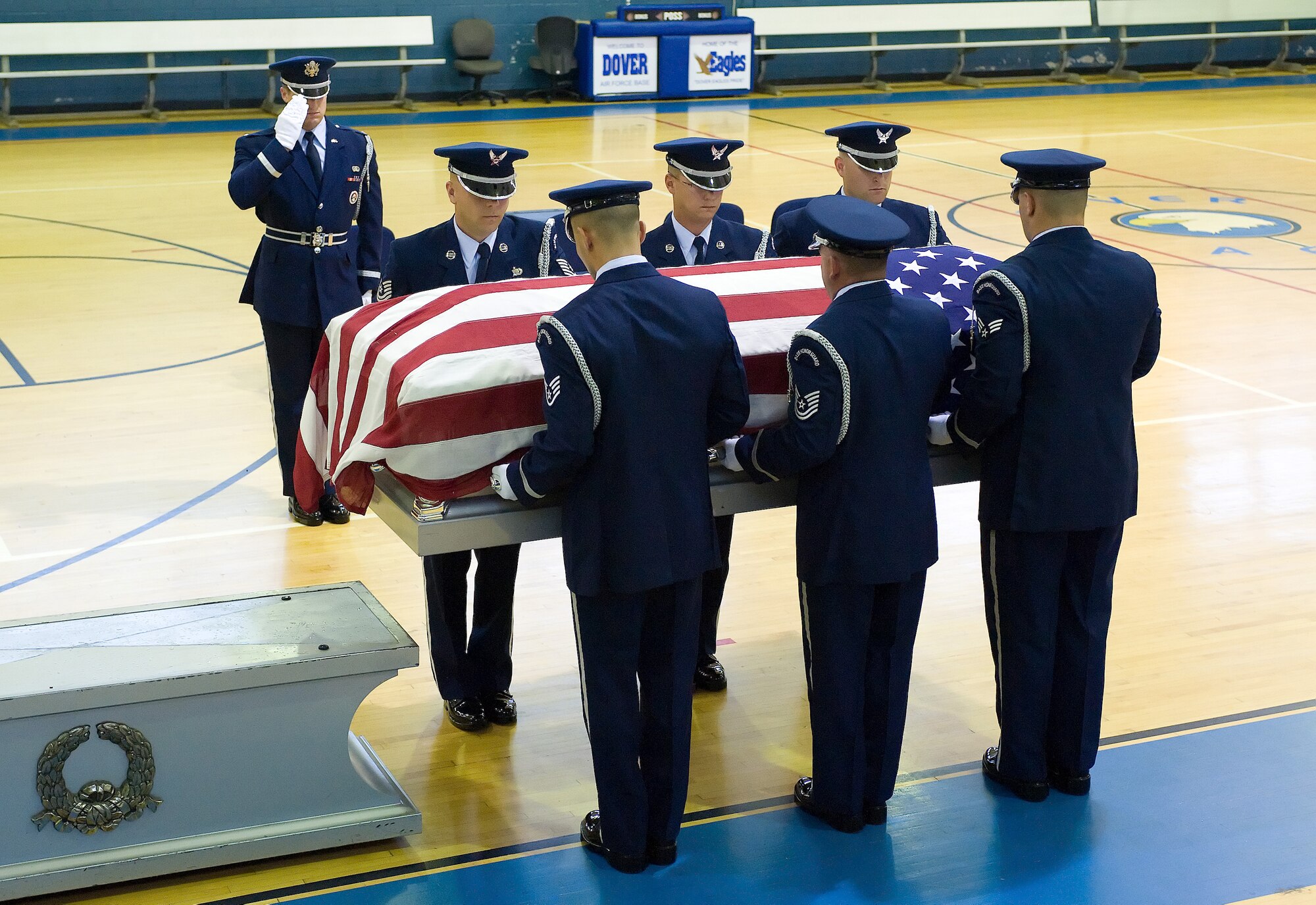 Members of the Team Dover Honor Guard demonstrate an official military funeral ceremony during their graduation ceremony at the Base Fitness Center on Dover Air Force Base, Del., Aug. 18, 2010. (U.S. Air Force photo by Jason Minto/Released)