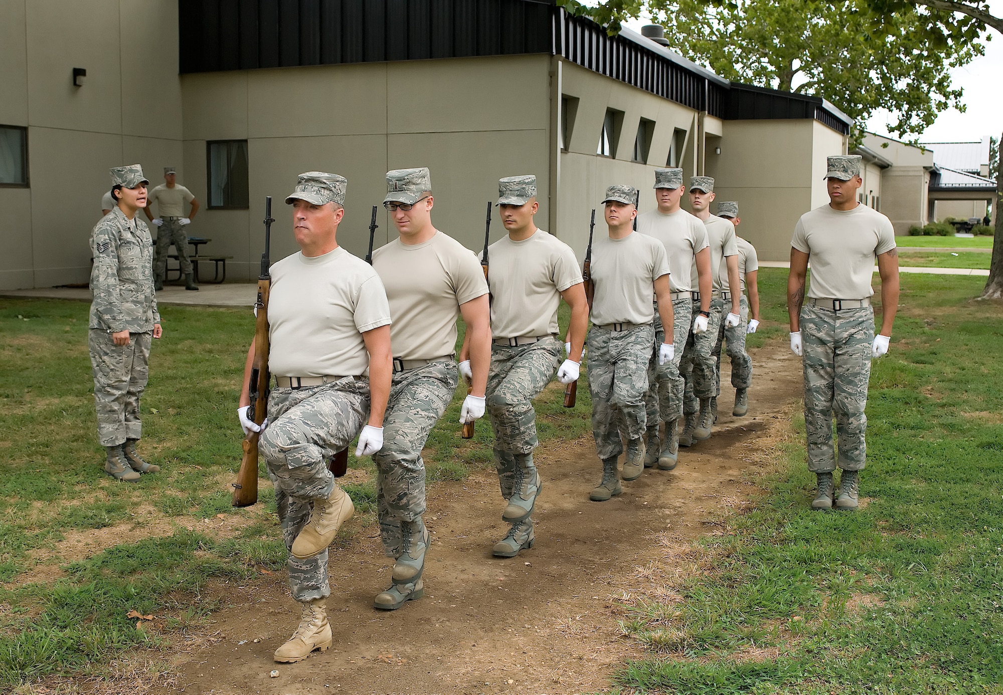 Staff Sgt. Krystie Martinez, U.S. Air Force Honor Guard, instructs a Team Dover ceremonial rifle team during training at the Base Honor Guard on Dover Air Force Base, Del., Aug. 13, 2010. Instructors from the U.S. Air Force Honor Guard visited to train Team Dover members on various Honor Guard duties. (U.S. Air Force photo by Jason Minto/Released)