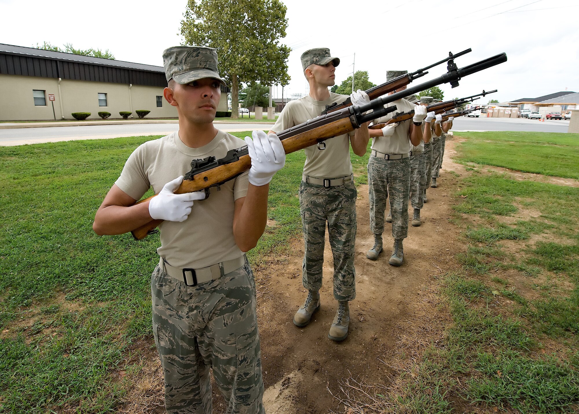 Members of the Team Dover Honor Guard demonstrate proper ceremonial rifle techniques during training at the Base Honor Guard on Dover Air Force Base, Del., Aug. 13, 2010. Instructors from the U.S. Air Force Honor Guard visited to train Team Dover members on various Honor Guard duties. (U.S. Air Force photo by Jason Minto/Released)