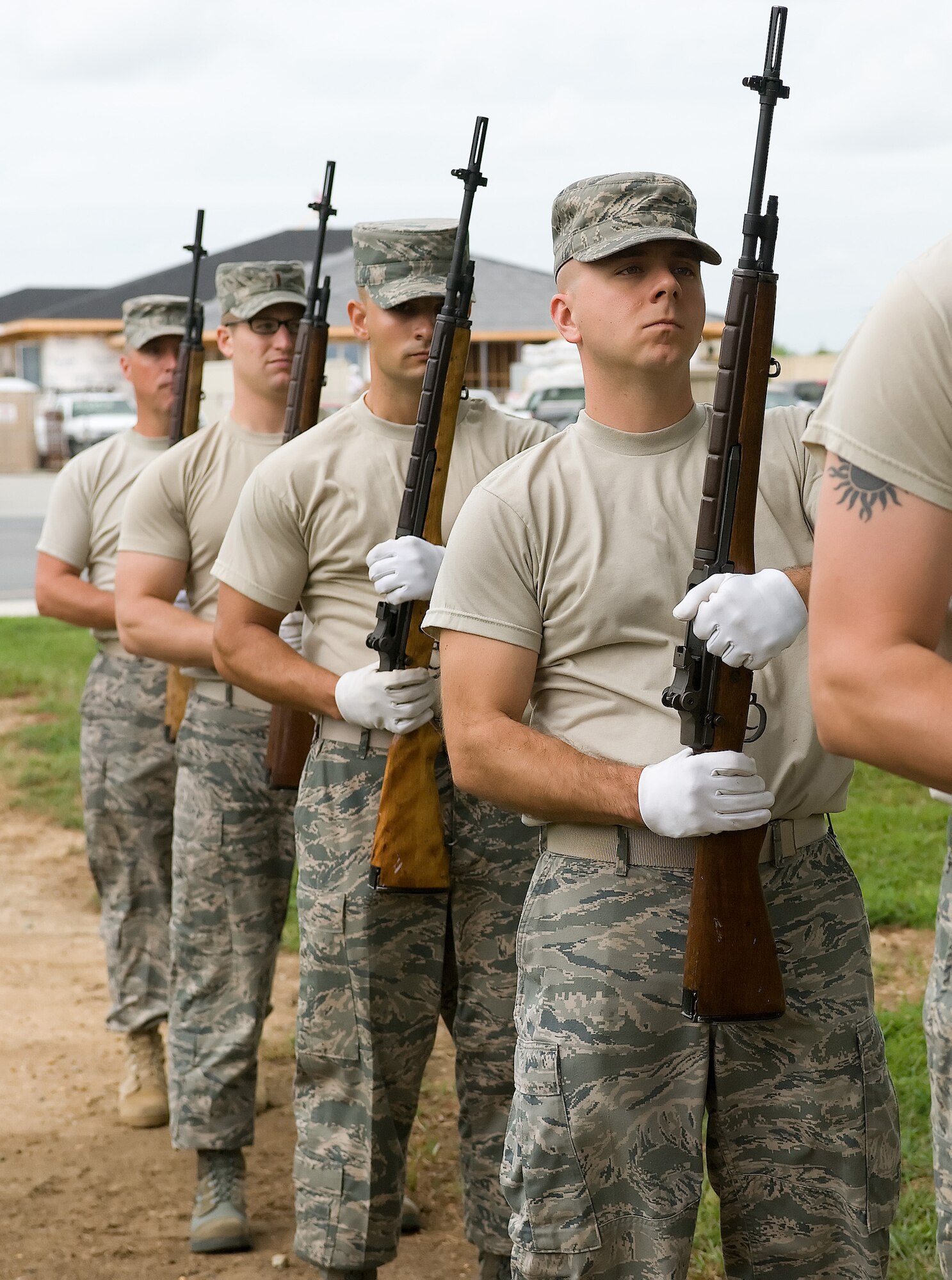 Members of the Team Dover Honor Guard demonstrate proper ceremonial rifle techniques during training at the Base Honor Guard on Dover Air Force Base, Del., Aug. 13, 2010. Instructors from the U.S. Air Force Honor Guard visited to train Team Dover members on various Honor Guard duties. (U.S. Air Force photo by Jason Minto/Released)