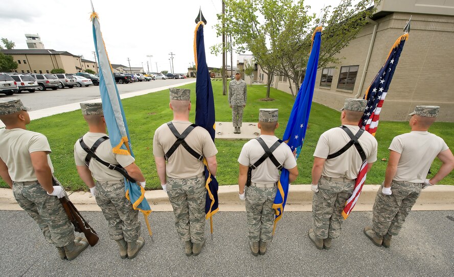 Airman 1st Class Jordan Anderson, U.S. Air Force Honor Guard, instructs Team Dover members on Honor Guard detail duties during training at the Base Honor Guard on Dover Air Force Base, Del., Aug. 13, 2010. Instructors from the U.S. Air Force Honor Guard visited to train Team Dover members on various Honor Guard duties. (U.S. Air Force photo by Jason Minto/Released)