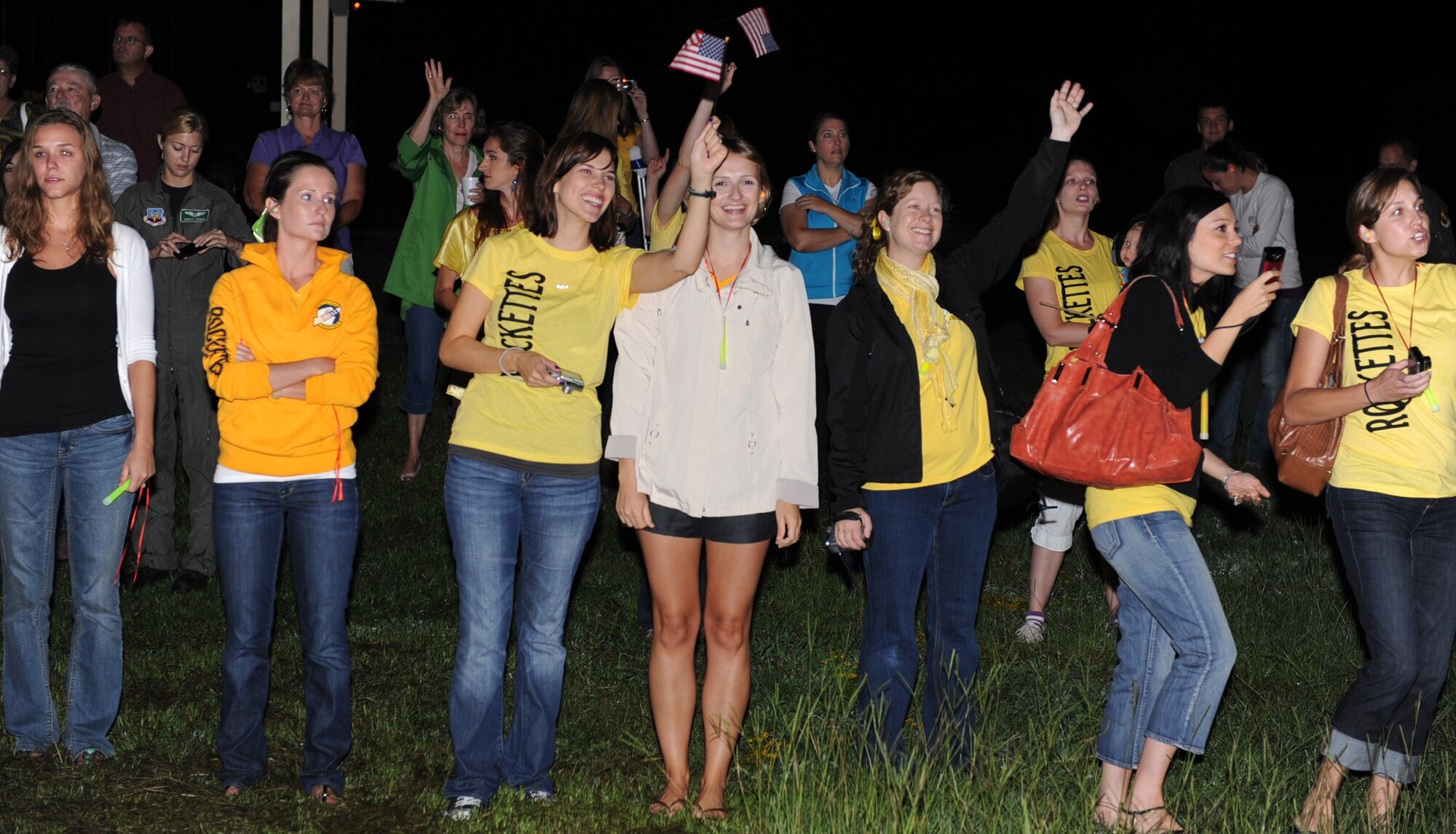 SEYMOUR JOHNSON AIR FORCE BASE, N.C. -- Spouses and family members of deploying aircrew members from the 336th Fighter Squadron wave goodbye to their loved ones as they taxi past in F-15E Strike Eagles here Aug. 25, 2010. The “Rockets” deployed to assume the close air support mission at Bagram Airfield, Afghanistan. (U.S. Air Force/Senior Airman Gino Reyes)