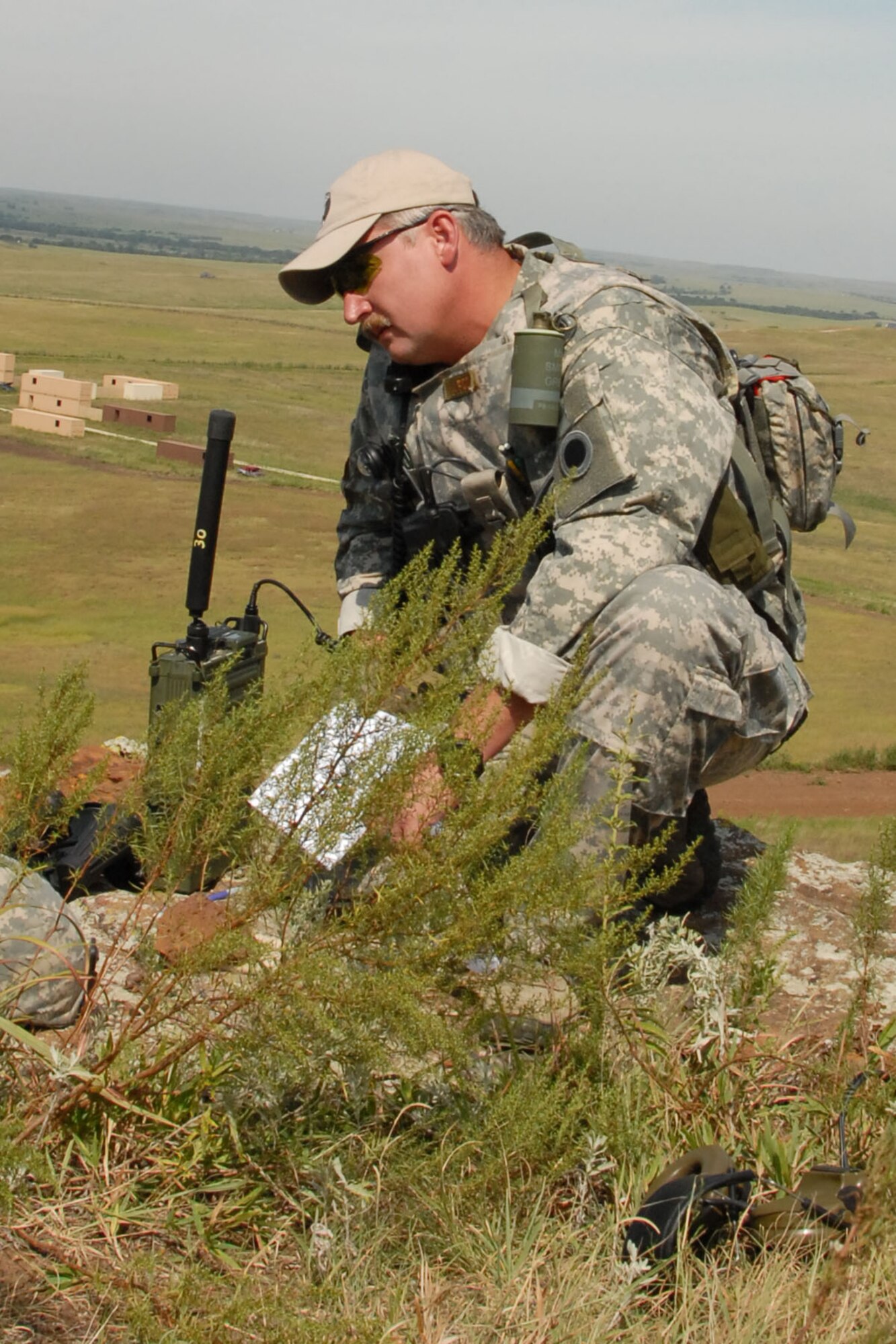 284th Air Support Operations Squadron commander Lt. Col. Gary Nash informs aircrews of enemy threat to his unit during an exercise scenario Aug. 19. Operation Viking Strike was a close air support exercise involving active duty and reserve component air support operations squadrons at Smoky Hill.